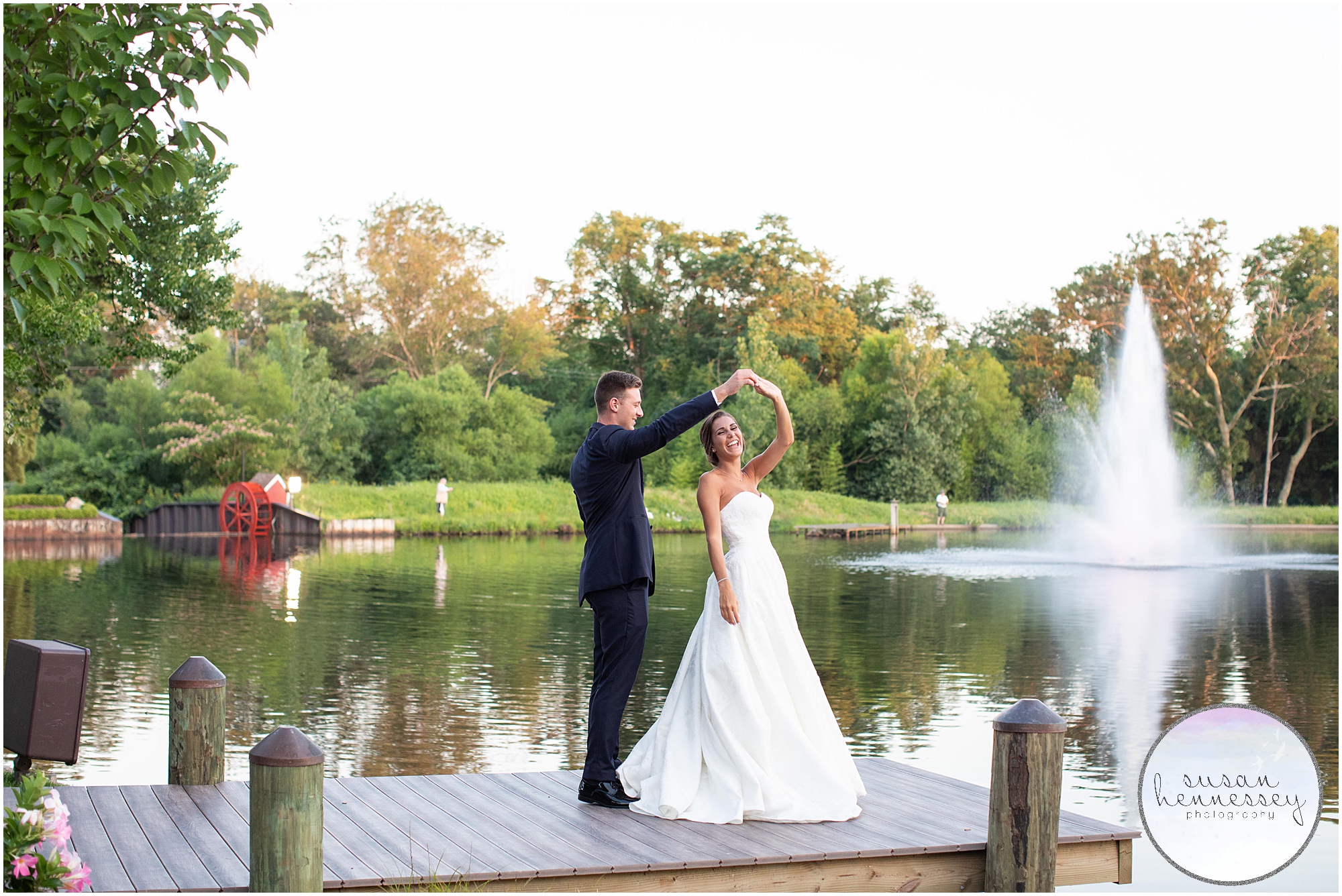 Groom twirls bride at Spring Lake wedding