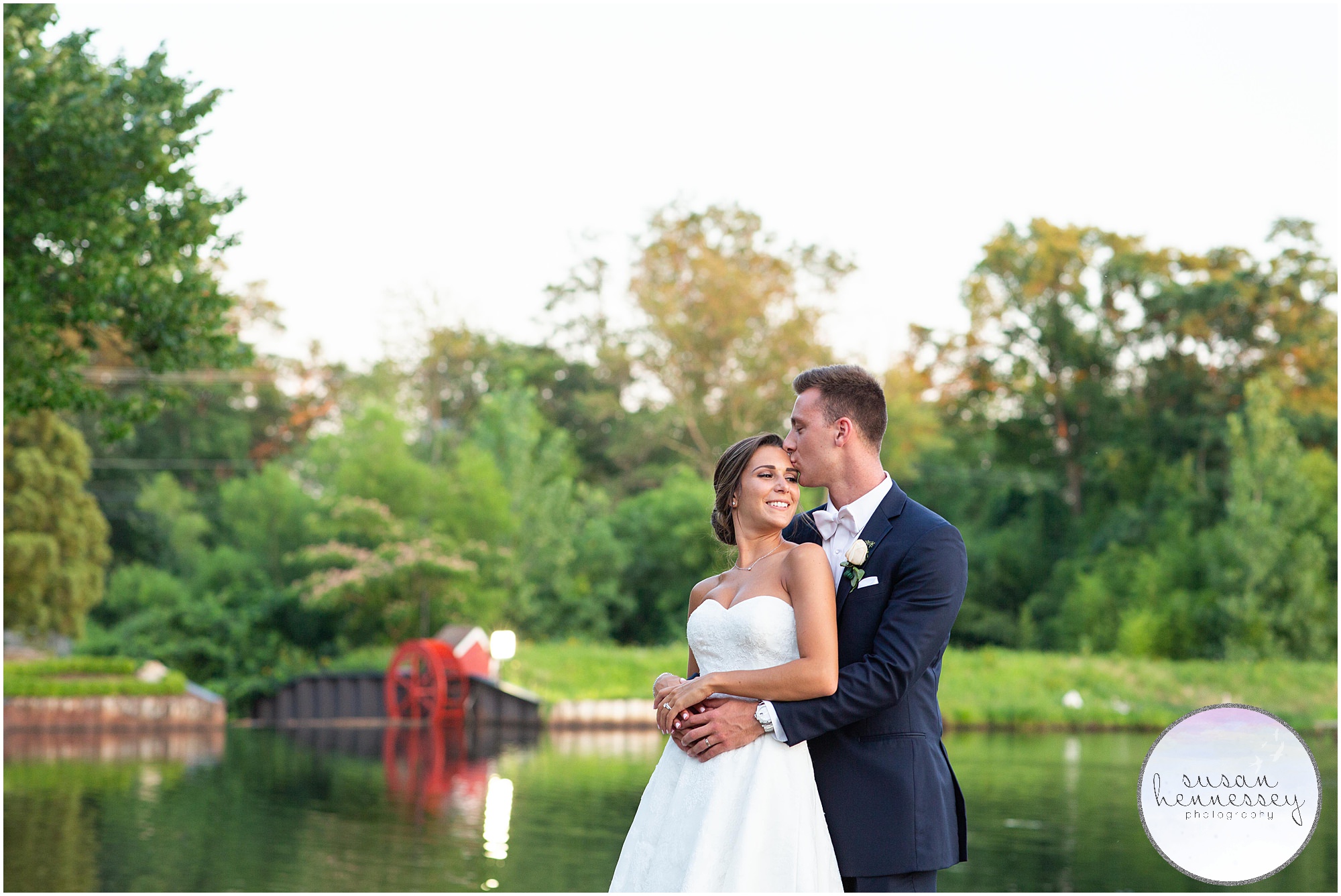 Golden hour portraits on lake with mill in background