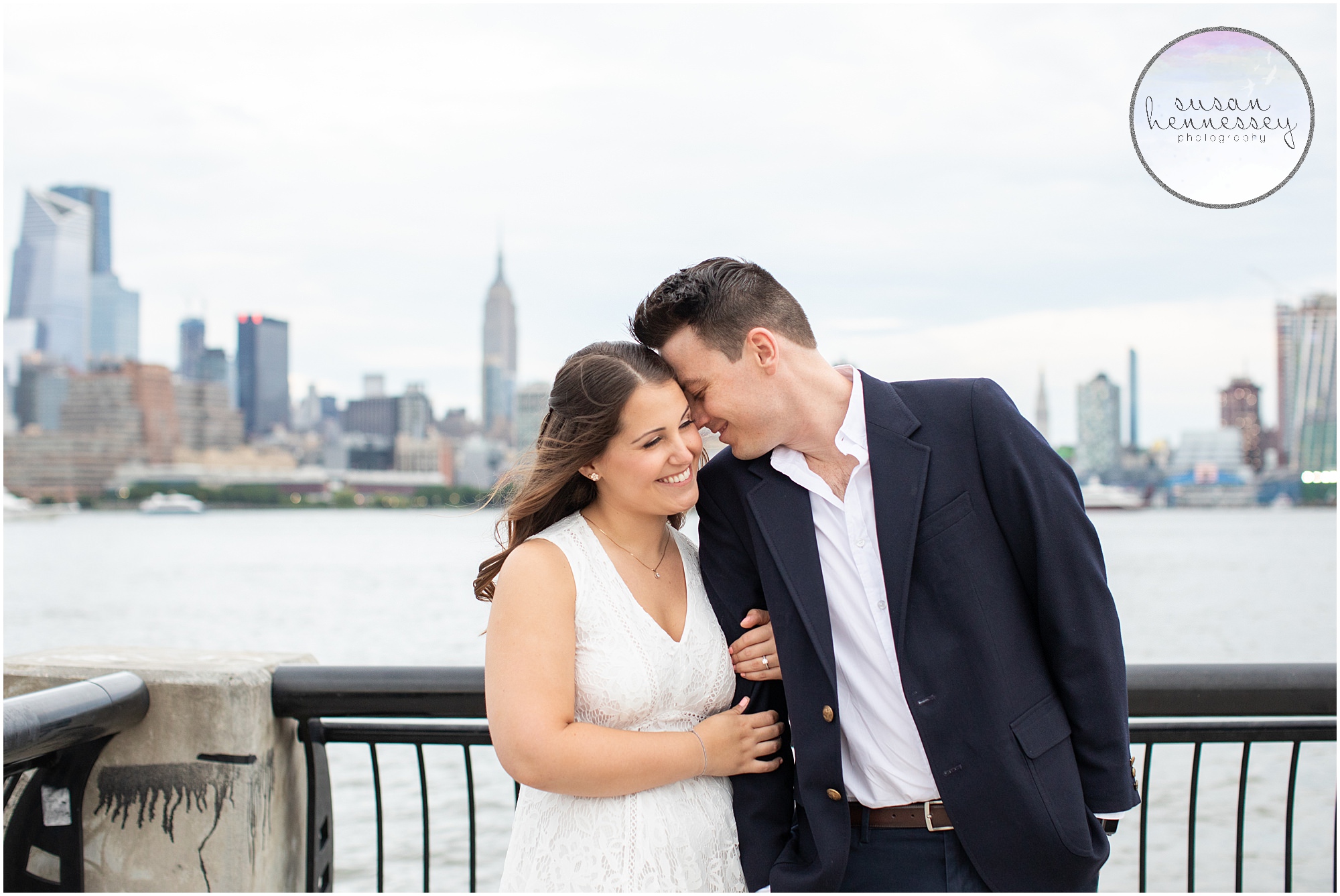 An engaged couple with the empire state building in the background.