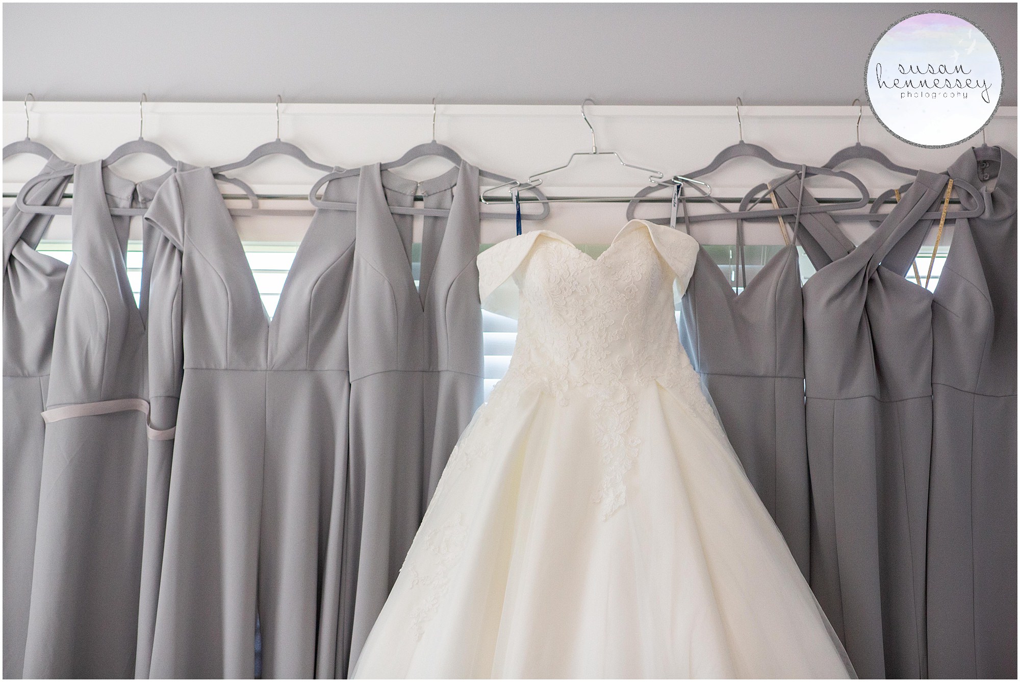 Bride's lace Kleinfeld's dress and gray bridesmaid dresses