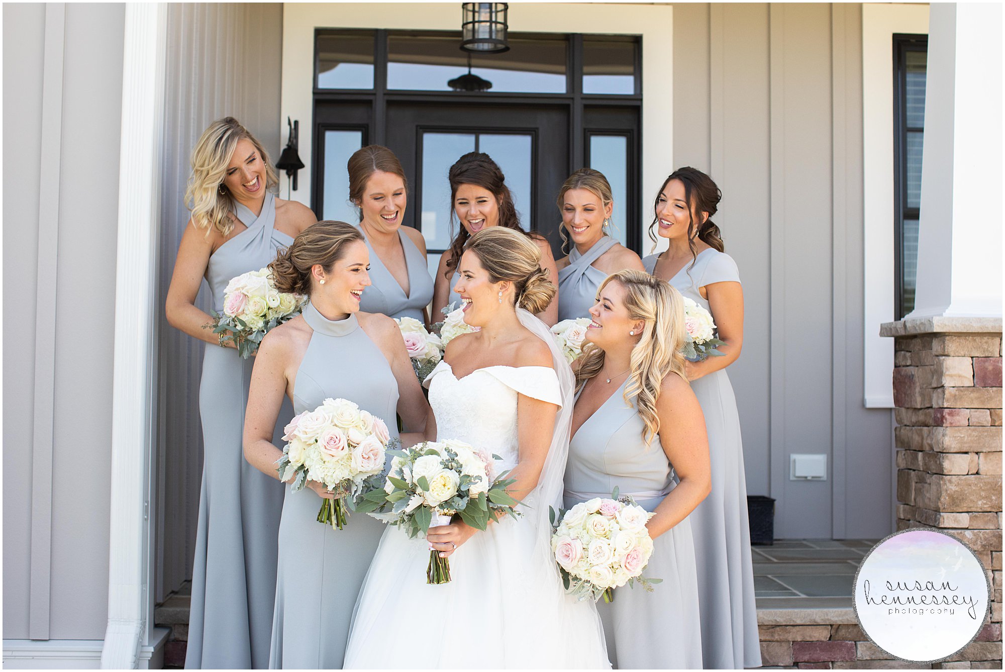 Bride and bridesmaids laugh before traditional church ceremony