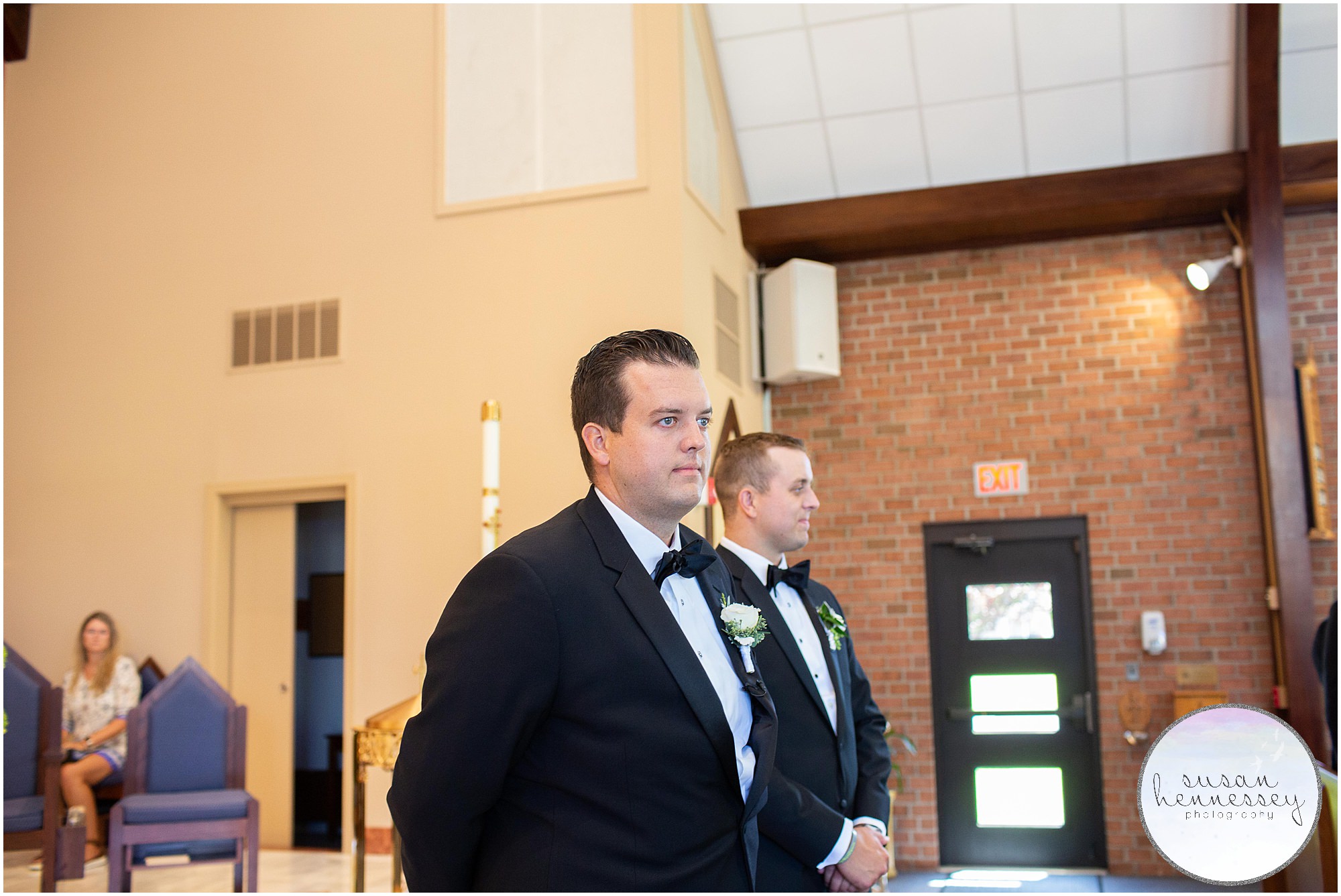 The groom waits for the bride at their Rehoboth Beach Country Club wedding