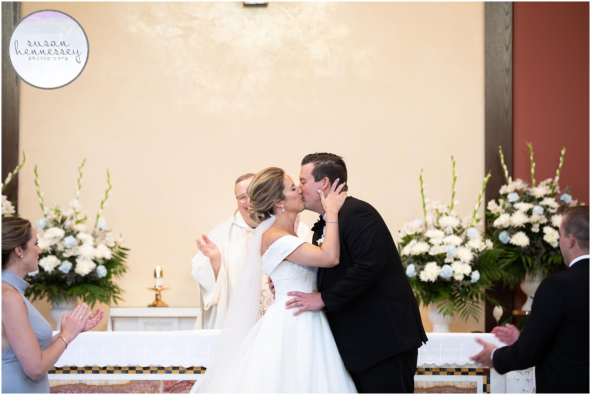 The bride and groom kiss for the first time at their Rehoboth Beach Country Club wedding