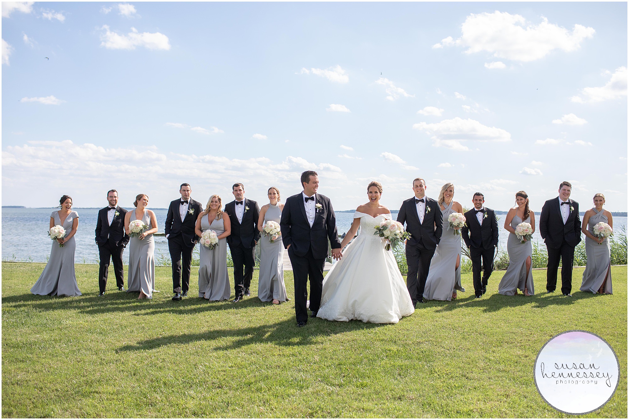 The bridal party walks across the lawn at Rehoboth Beach Country Club wedding