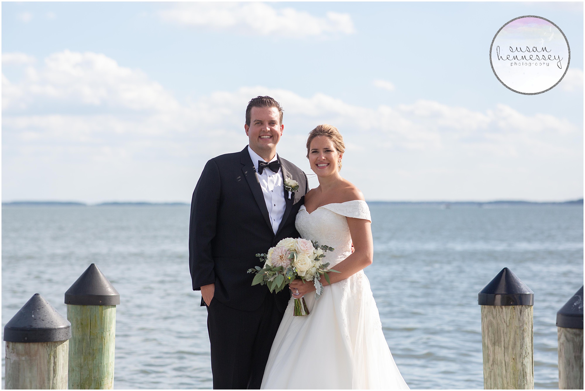 Waterfront portraits on sunny wedding day