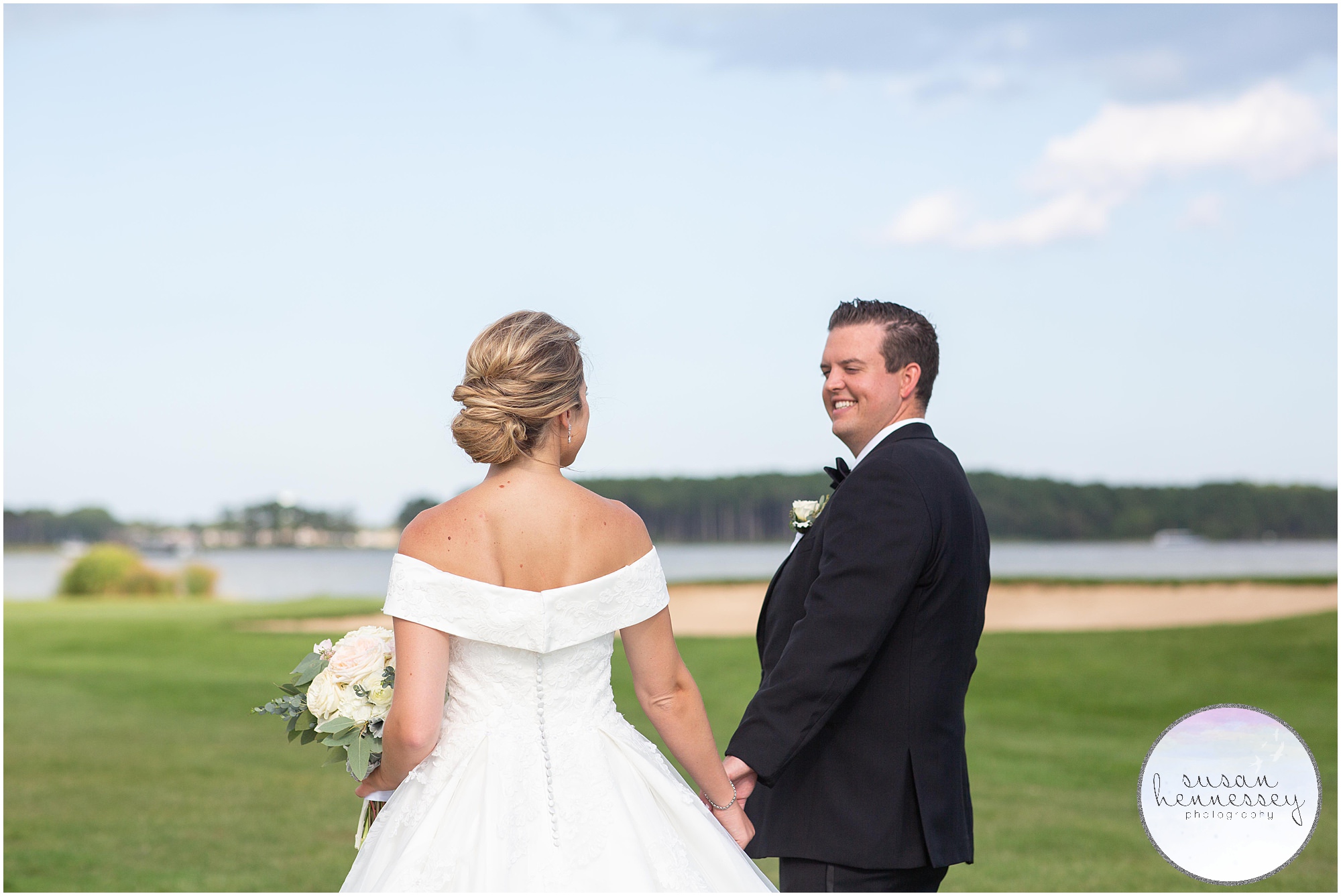 A bride and groom on waterfront golf course in Rehoboth Beach
