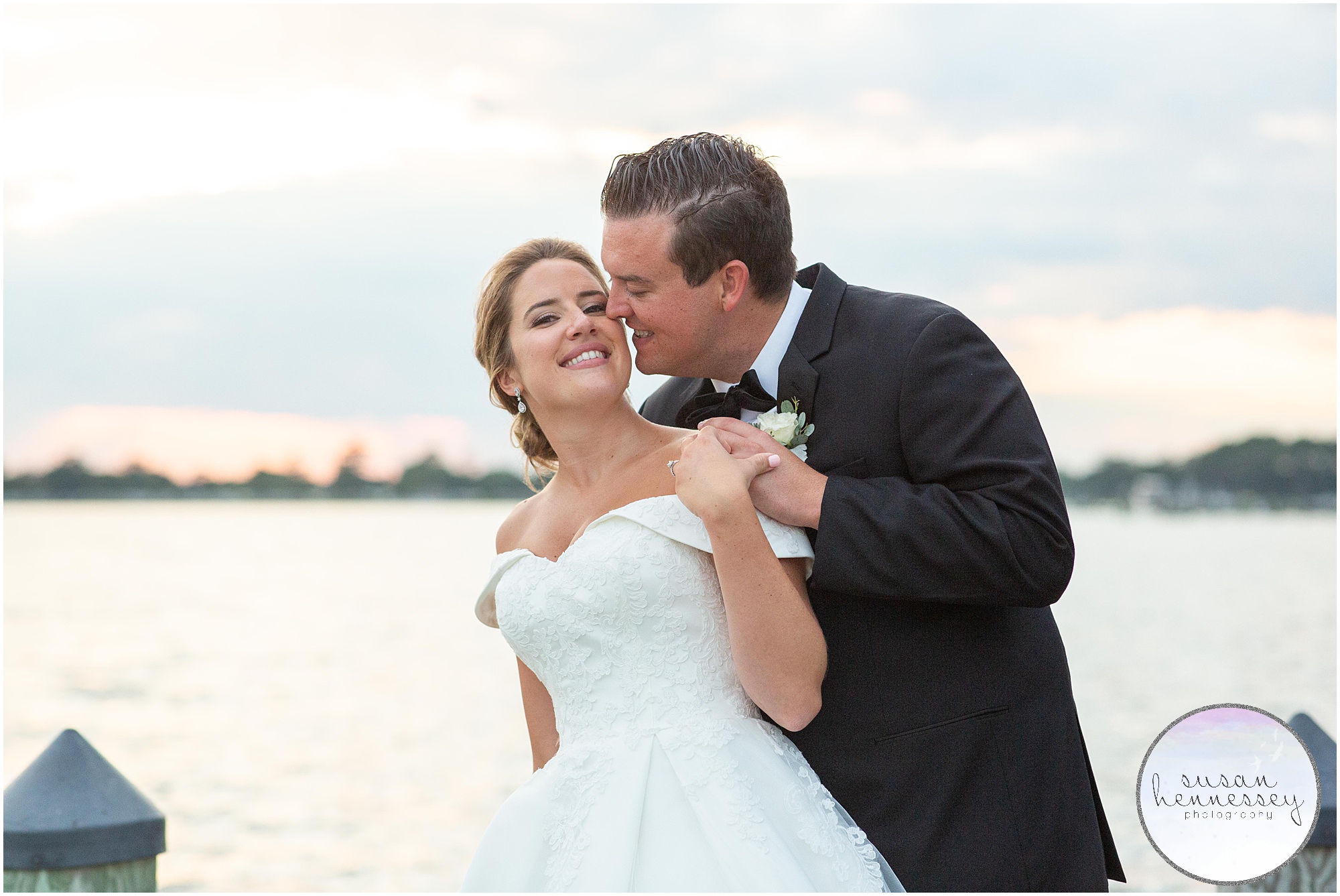 Sunset photos of couple at their waterfront wedding