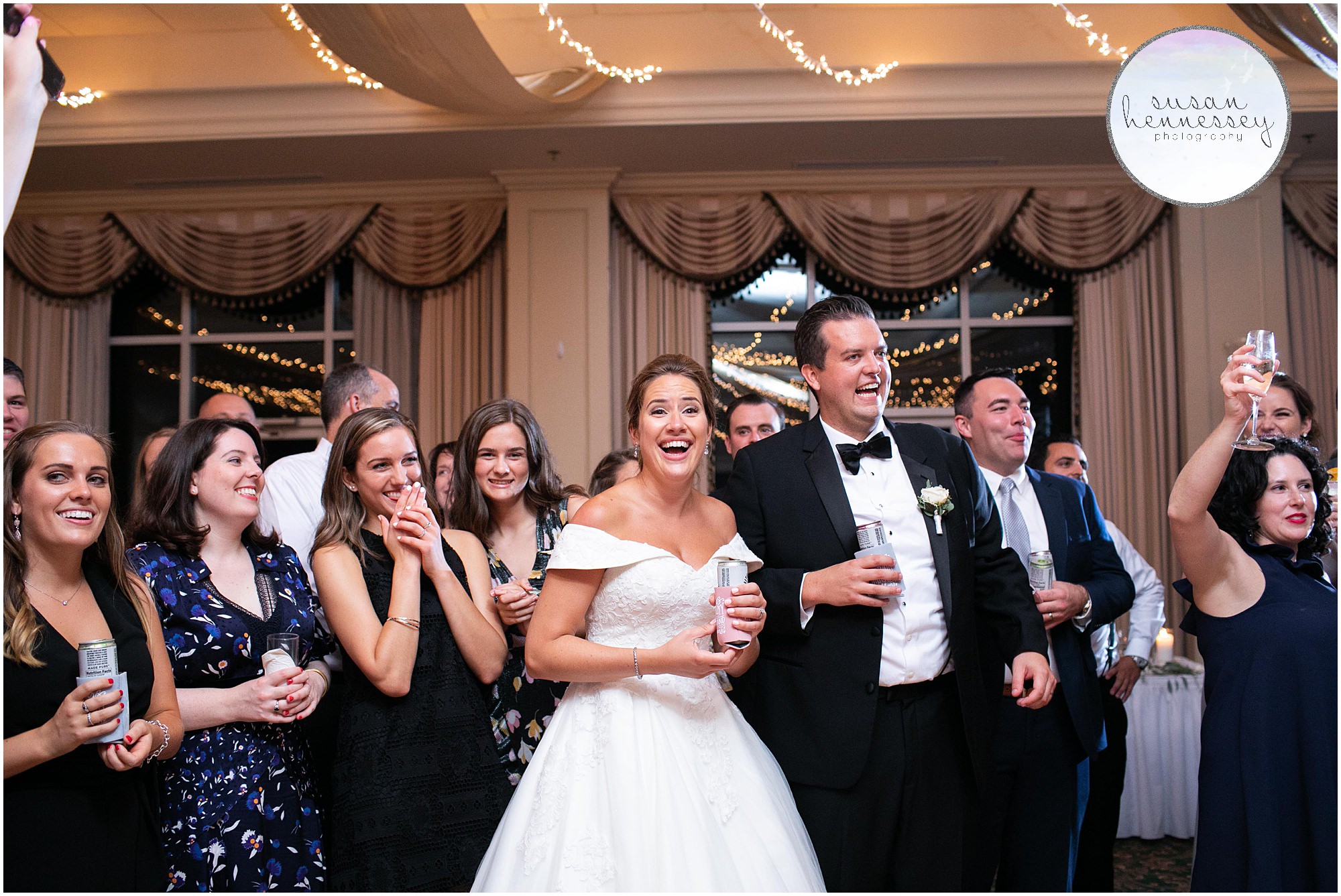 Bride and groom have fun at rehoboth beach country club wedding reception