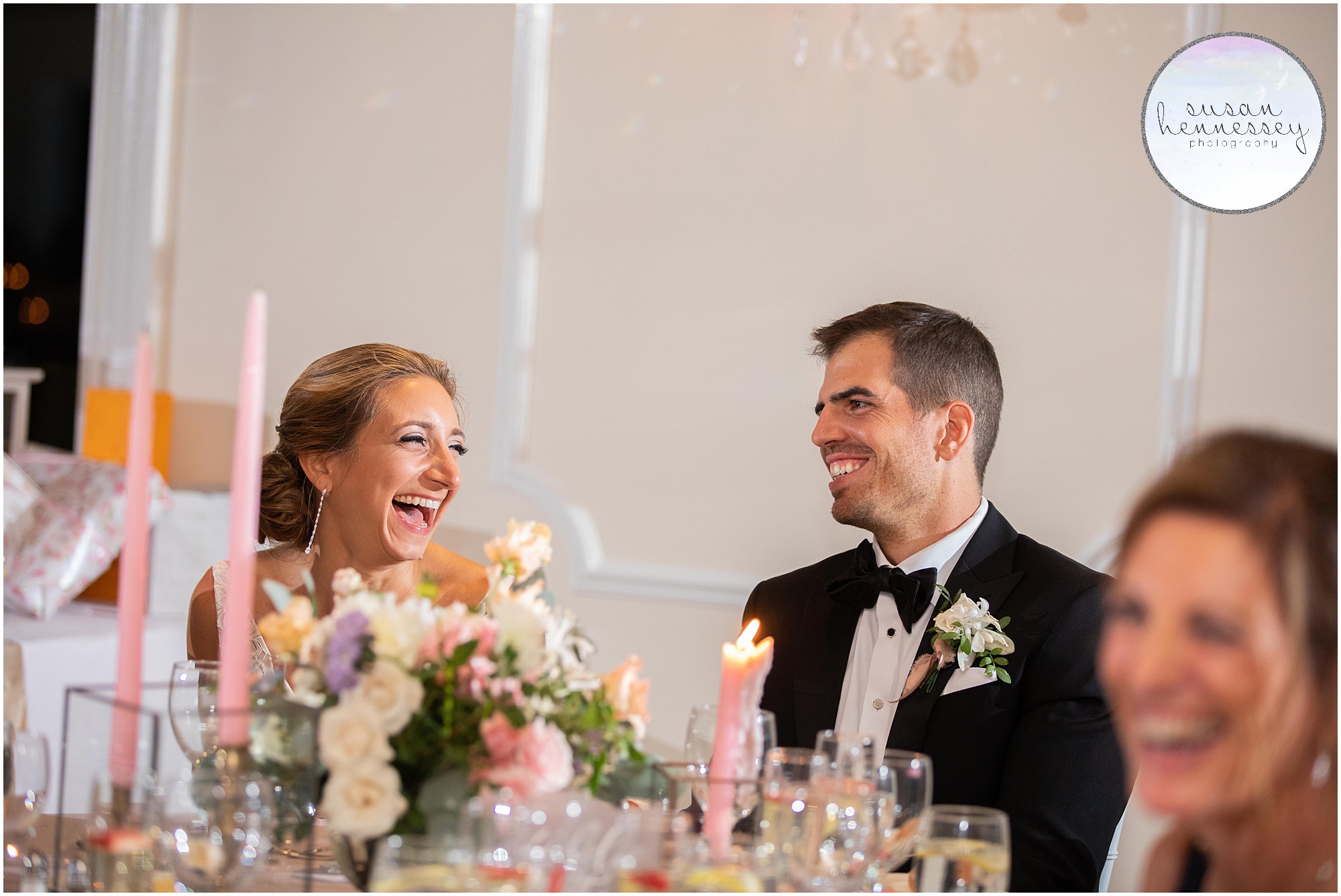 Couple laughs during speeches at their Windows on the Water reception