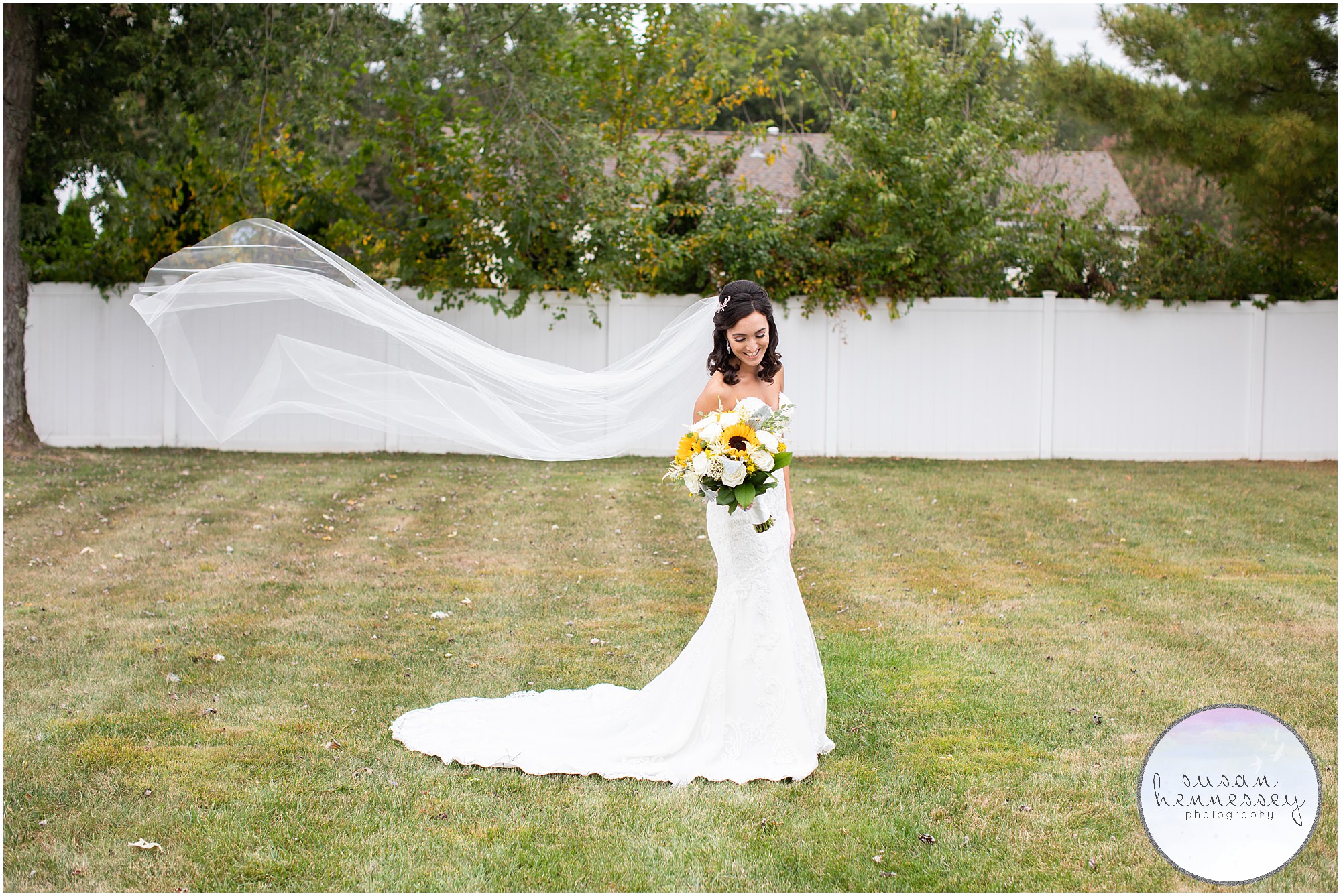 Bride's veil blows in wind