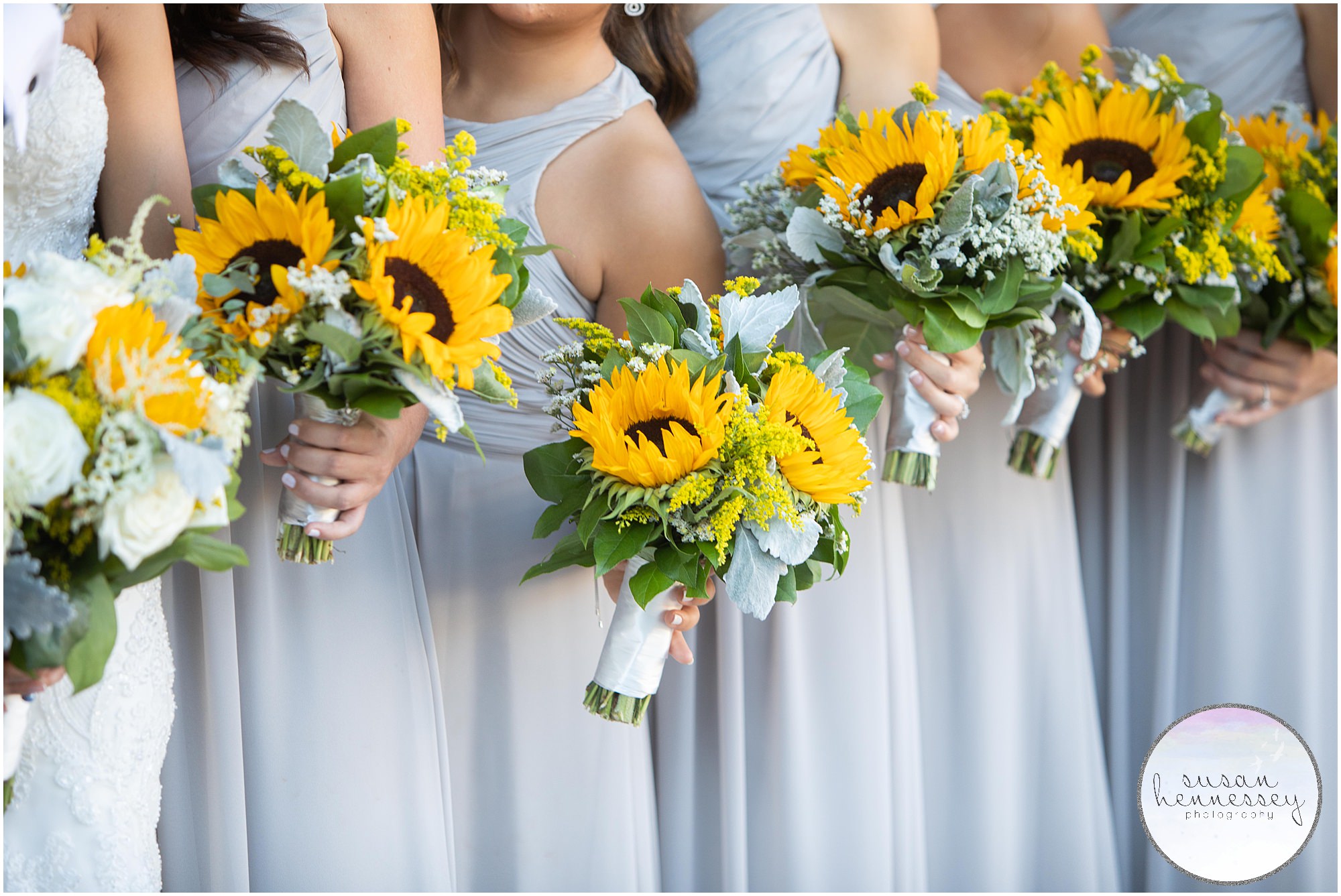 Detail of sunflower bouquets during bridal party portraits