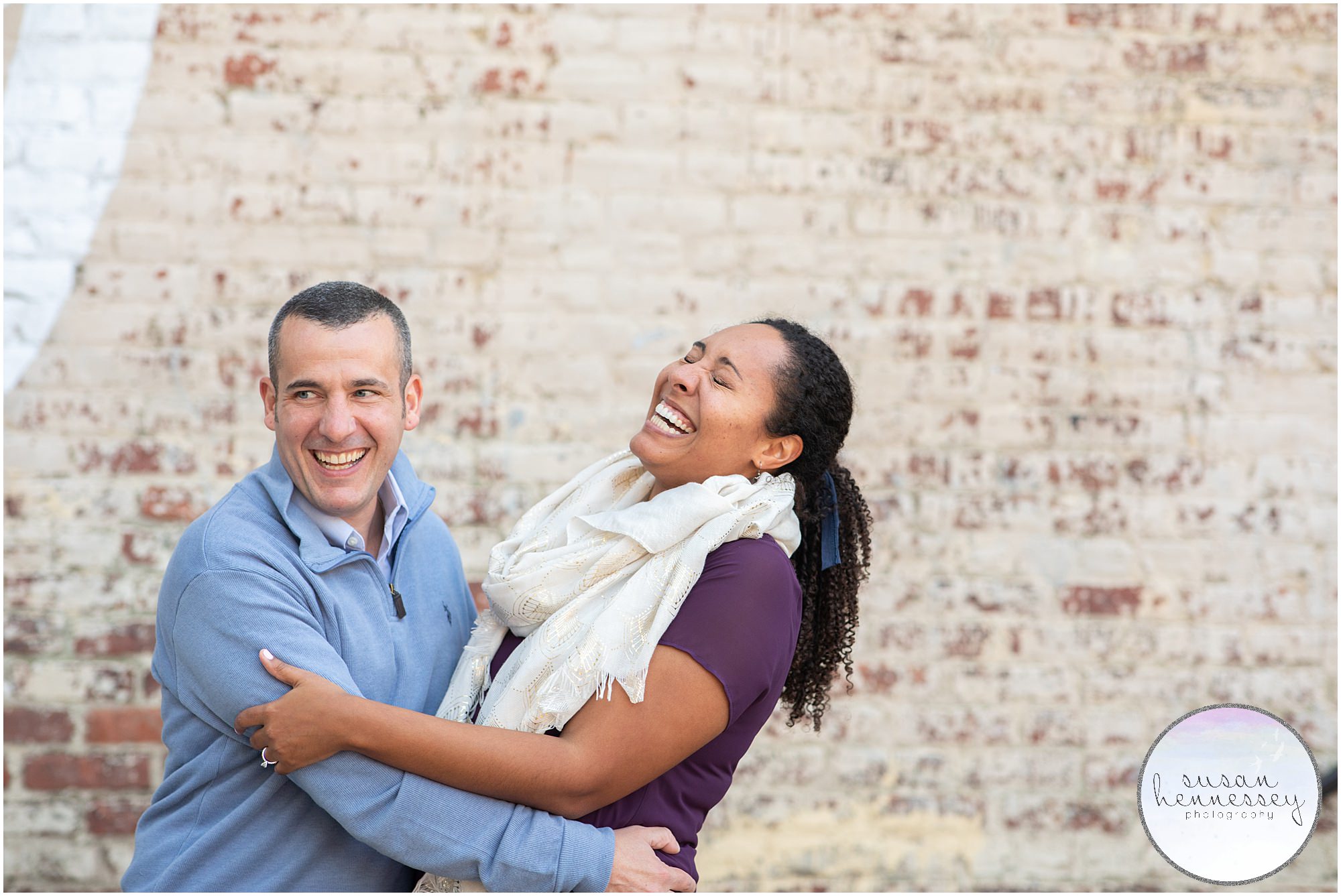 A couple laugh in Northern Liberties at their Philadelphia engagement session