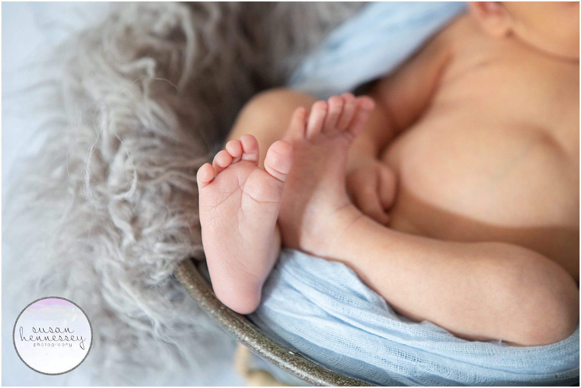 A close up of newborn baby boy's feet