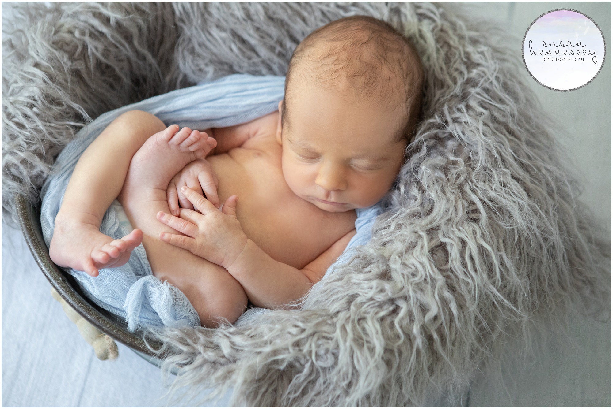 A blue and gray newborn photography session