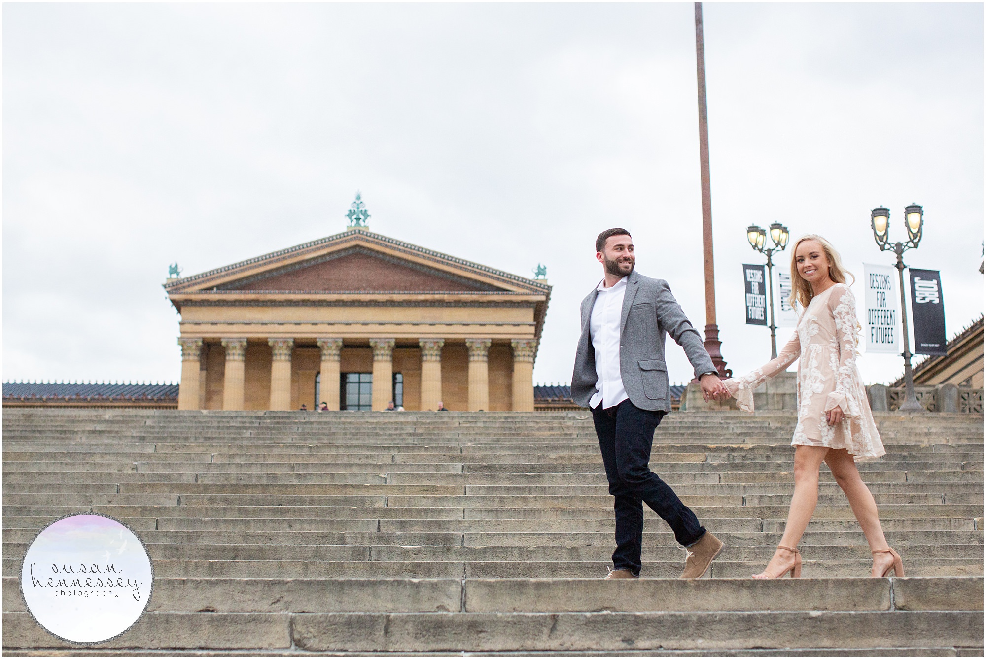 An engaged couple on the Art Museum stairs in Philadelphia