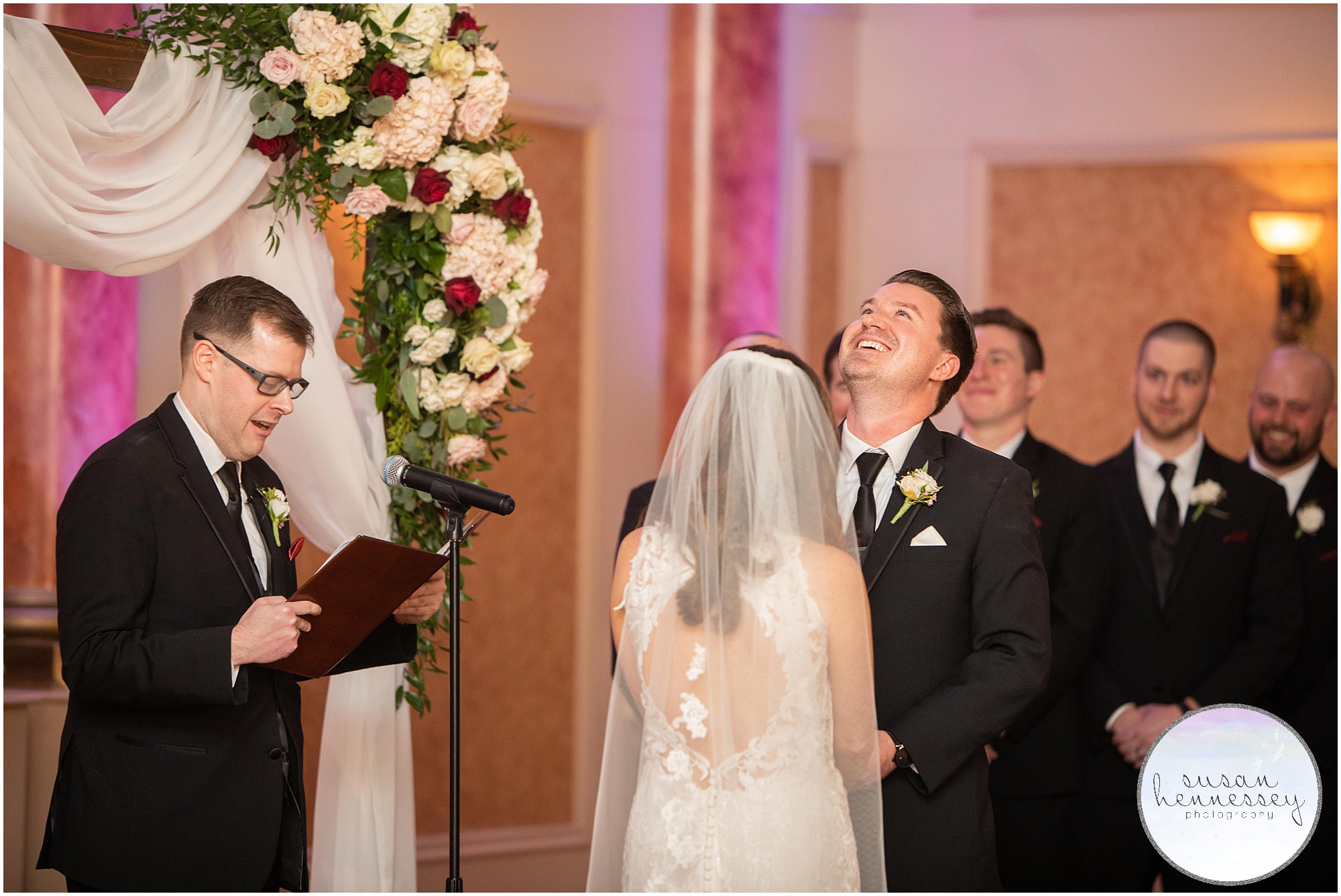 Groom laughs during ceremony at the merion