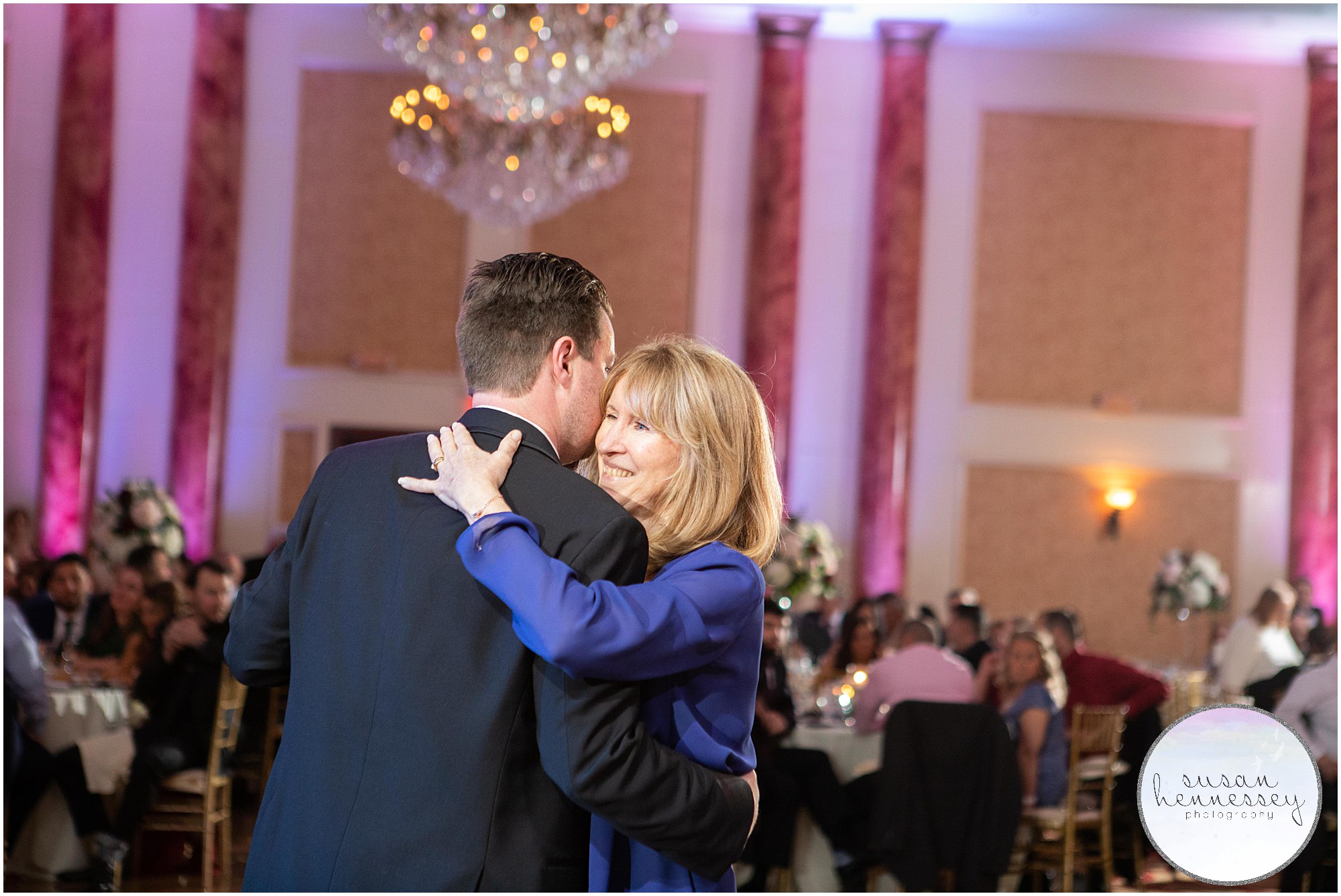 The groom dances with his mother at wedding reception