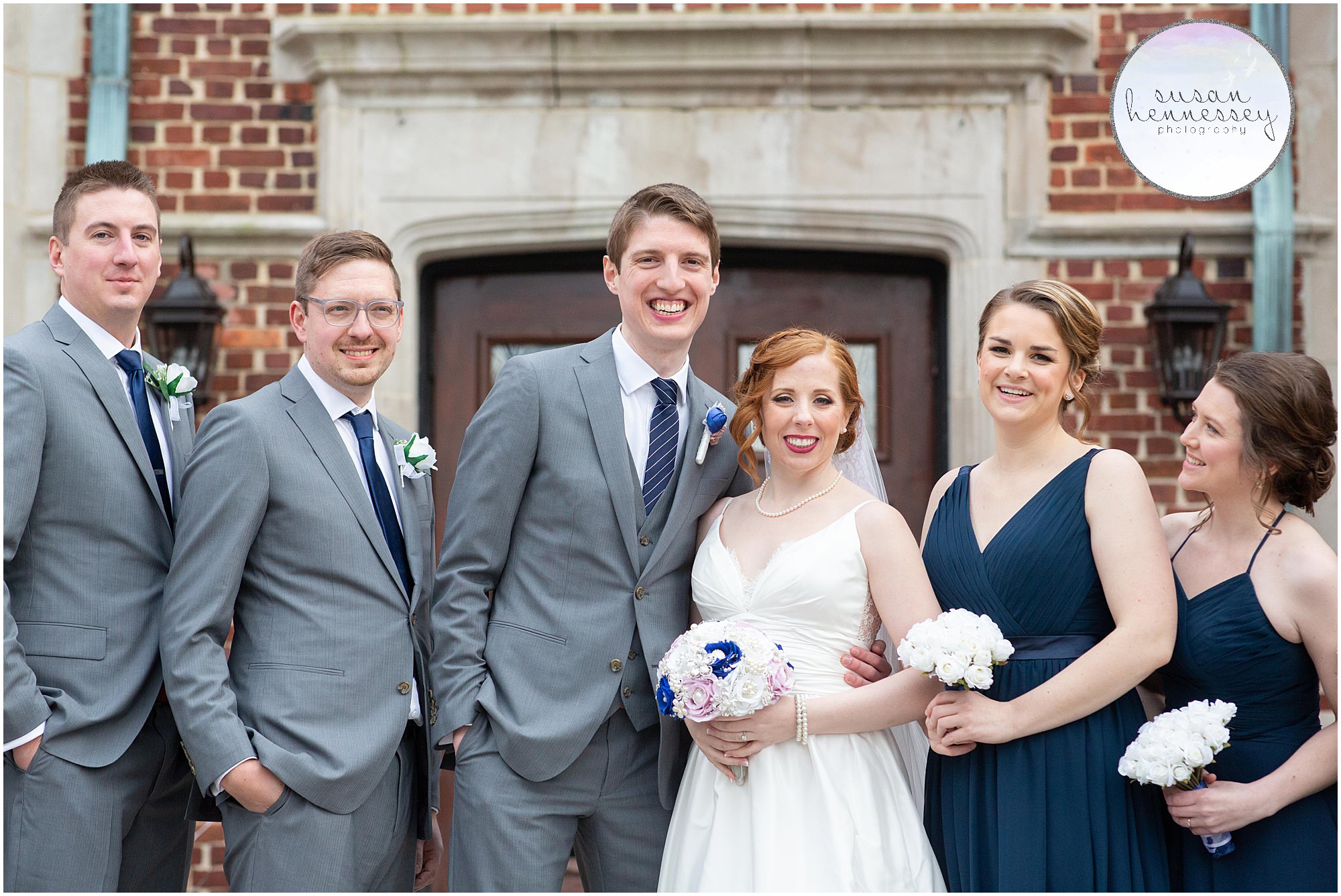 Happy bride and groom with their bridal party 