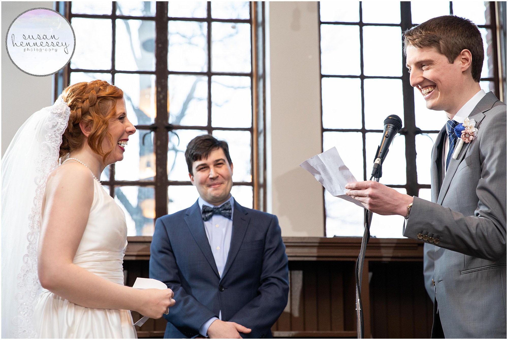 Groom reads his vows at indoor winter ceremony