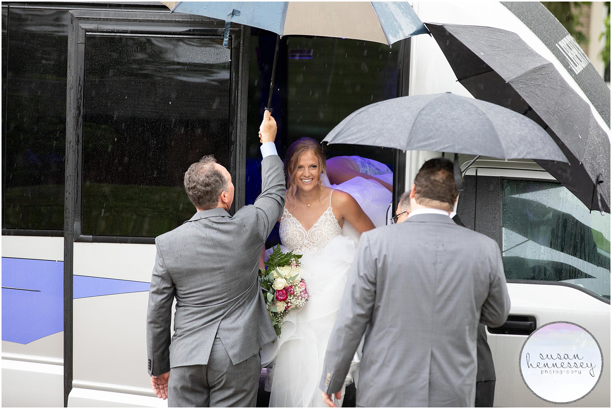 Bride arrives for her microwedding ceremony in the rain