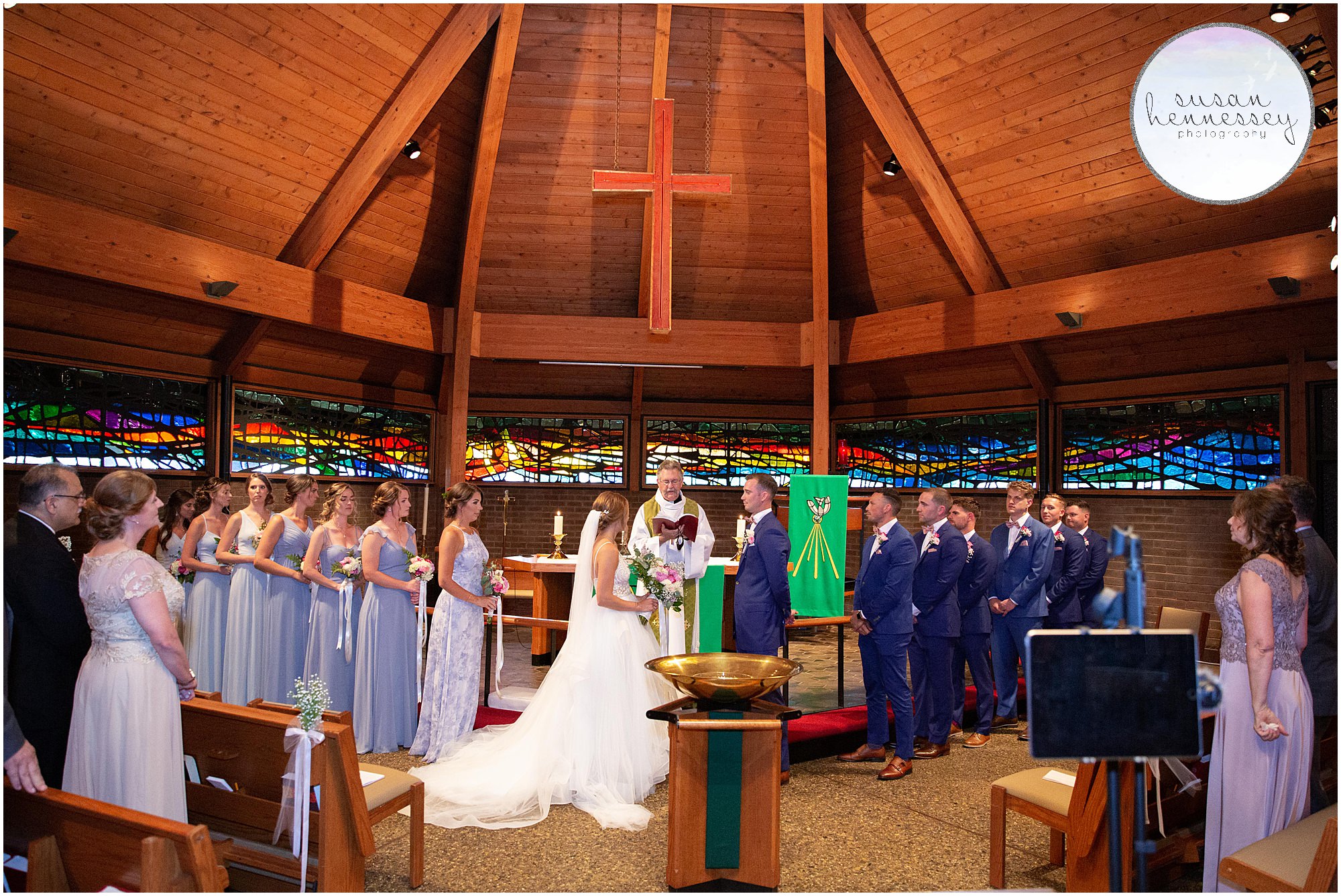 Bridal party stands at alter at church in cherry hill