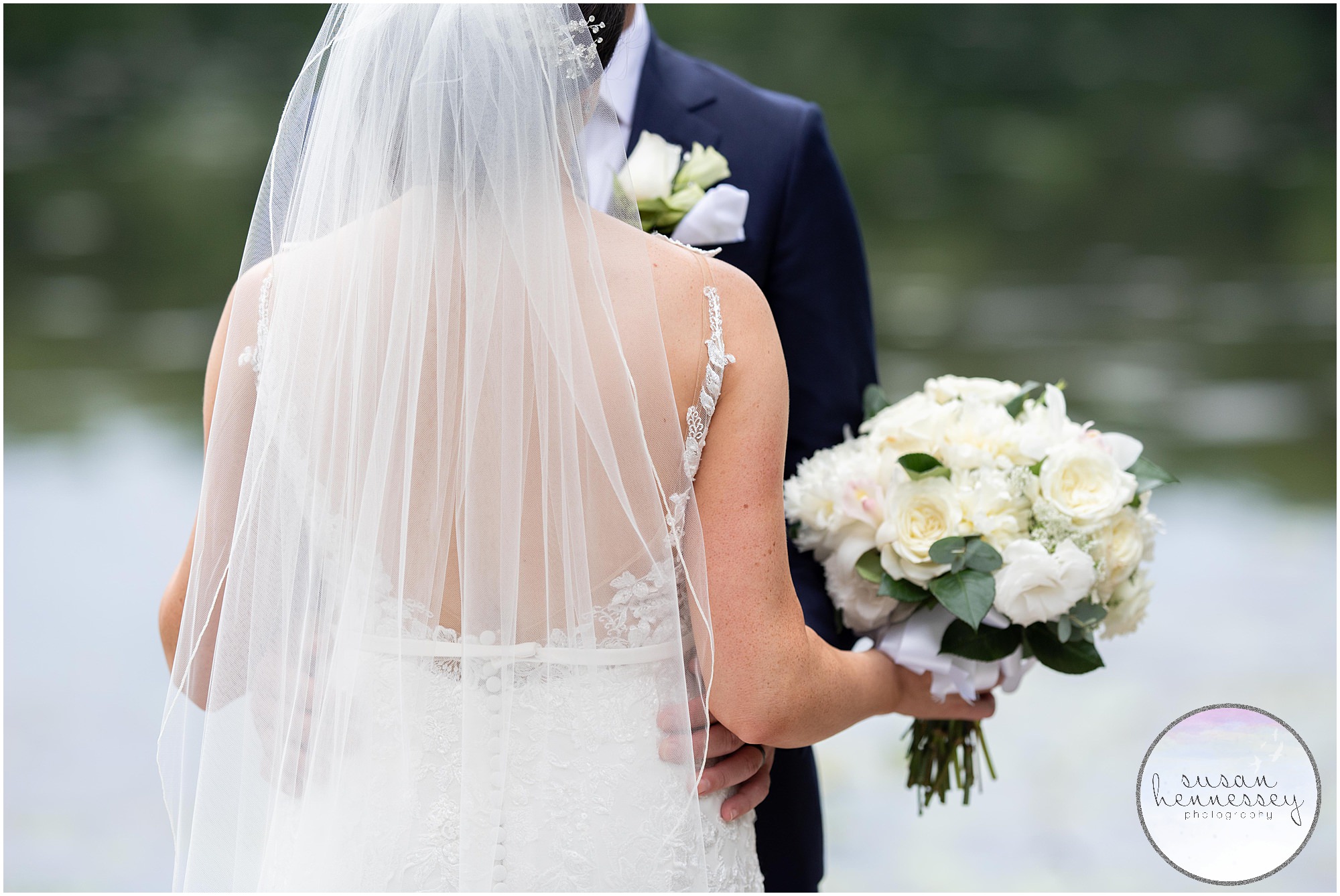 Details of bride's dress and bouquet