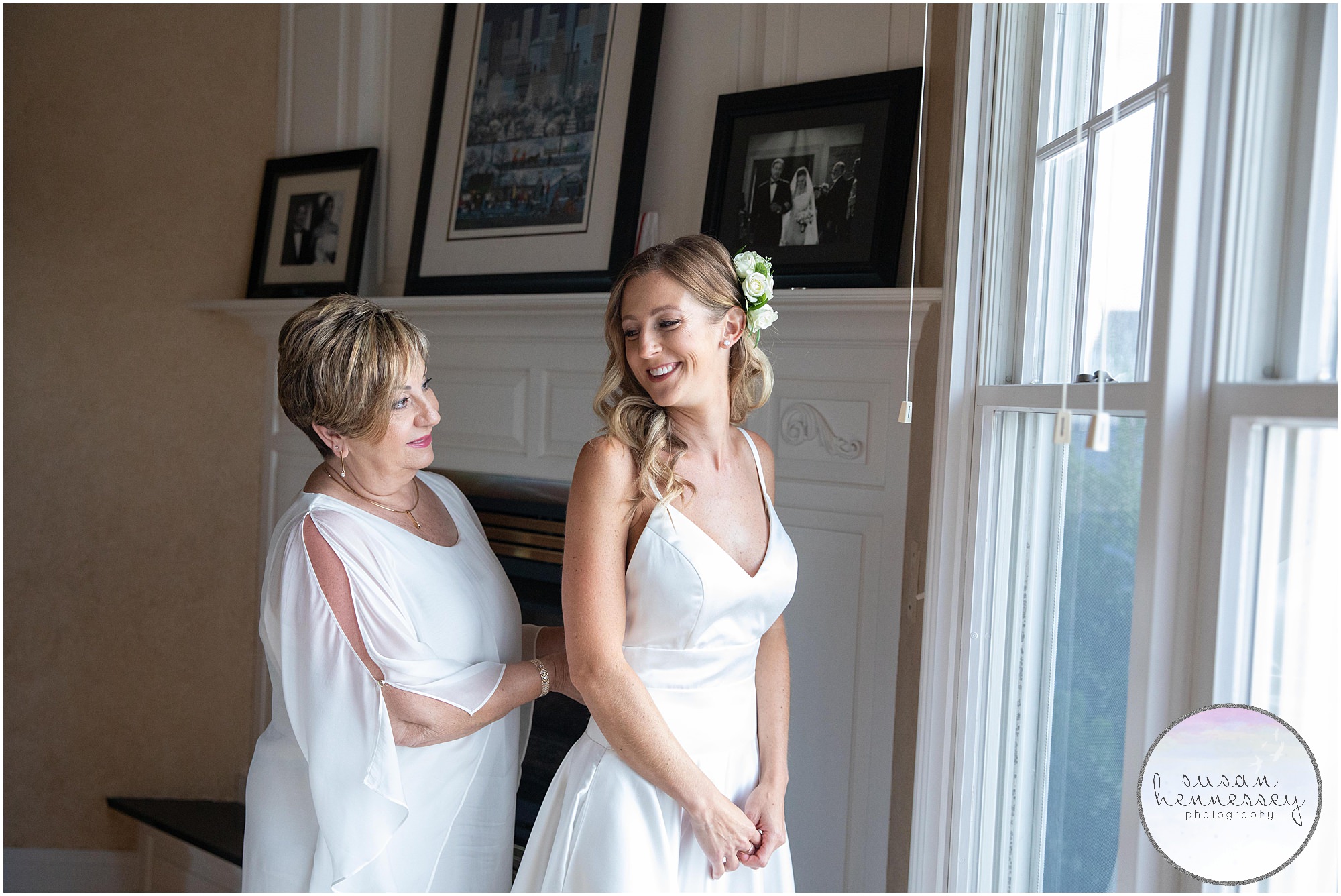 Mother of the bride helps bride into her dress for her Jersey Shore microwedding