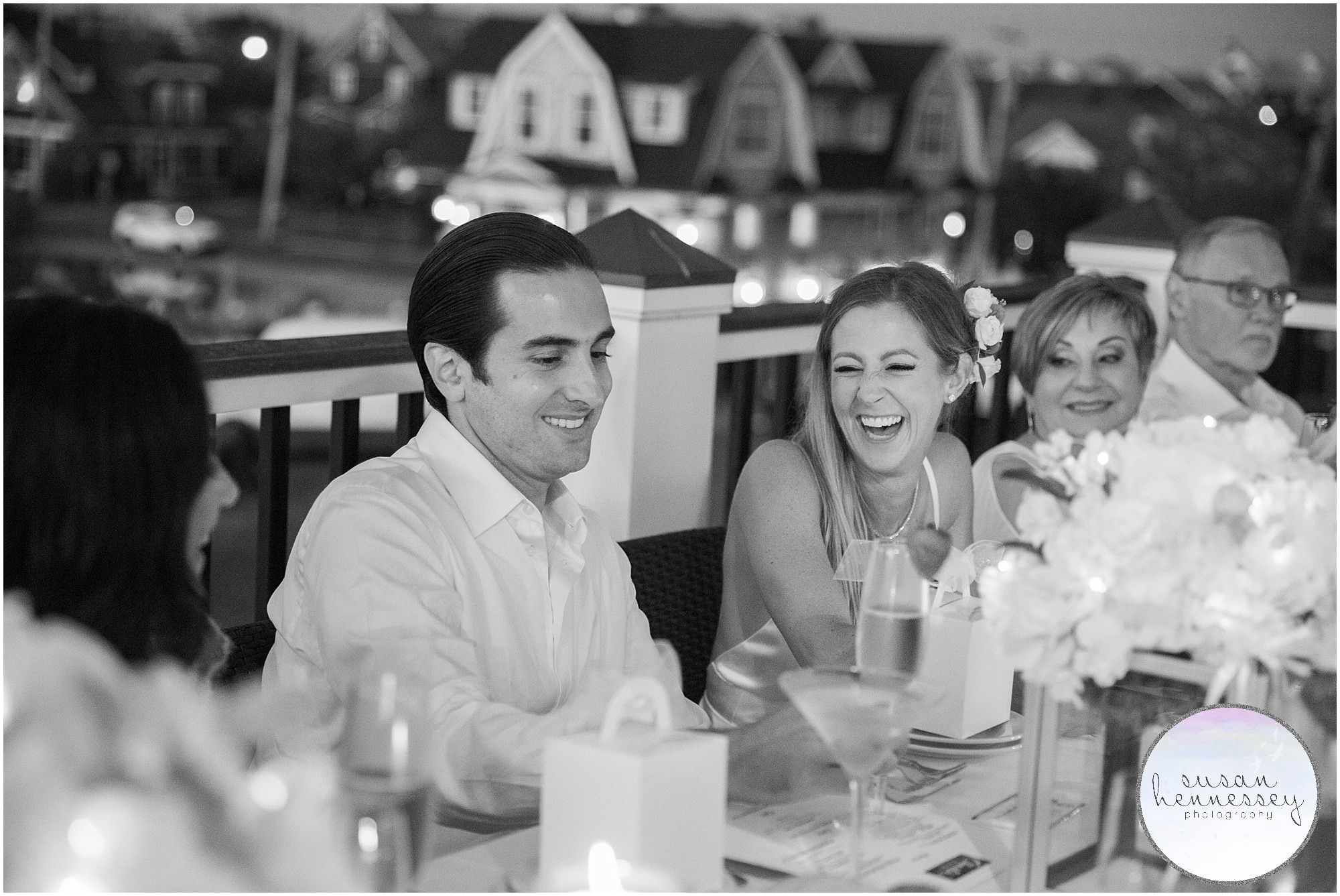 Couple laugh during toasts at South Jersey microwedding at Charlie's of Bay Head 
