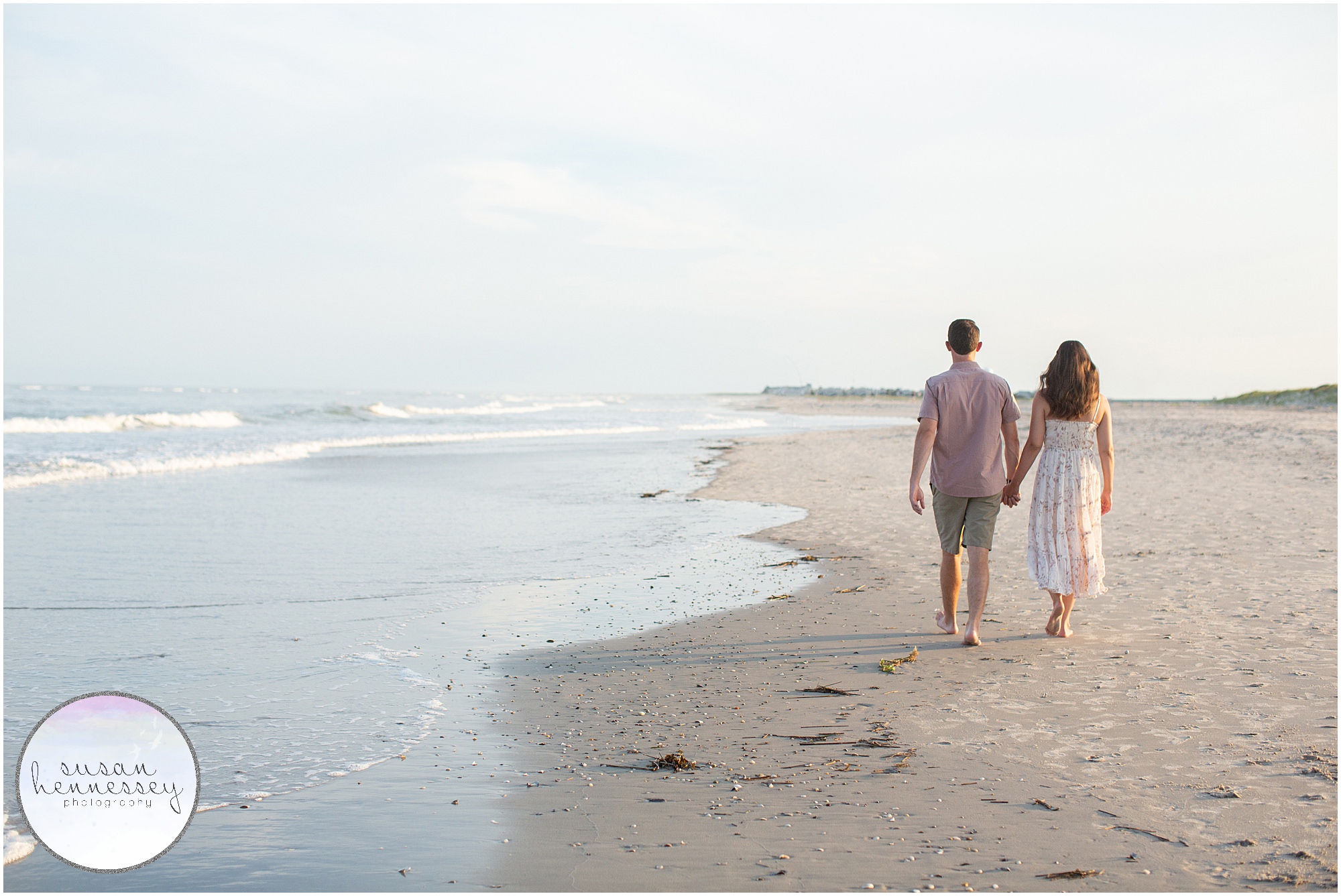 A couple walk on the beach at Corson's Inlet Engagement Session