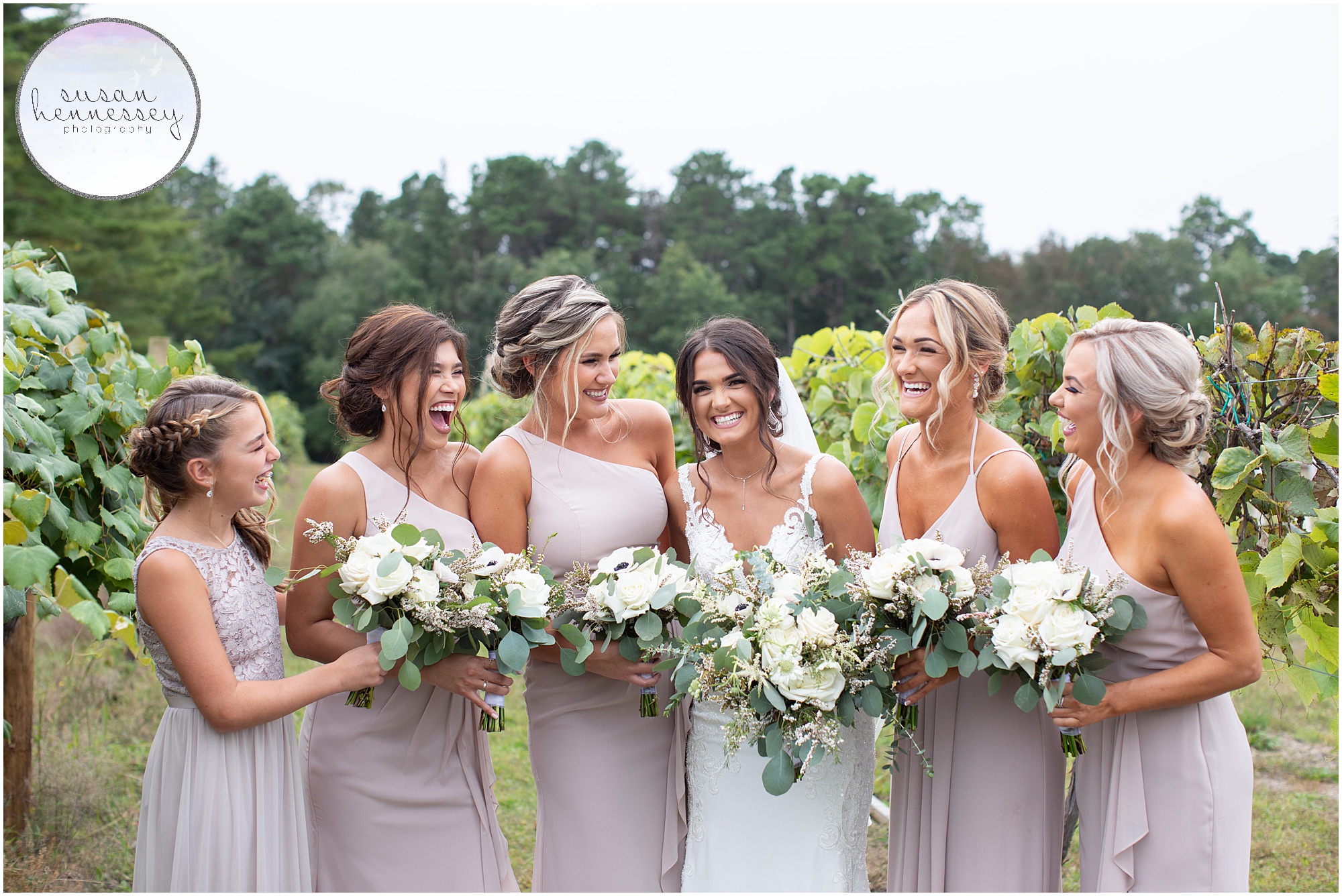 Bride and bridesmaids laugh at Renault Winery wedding