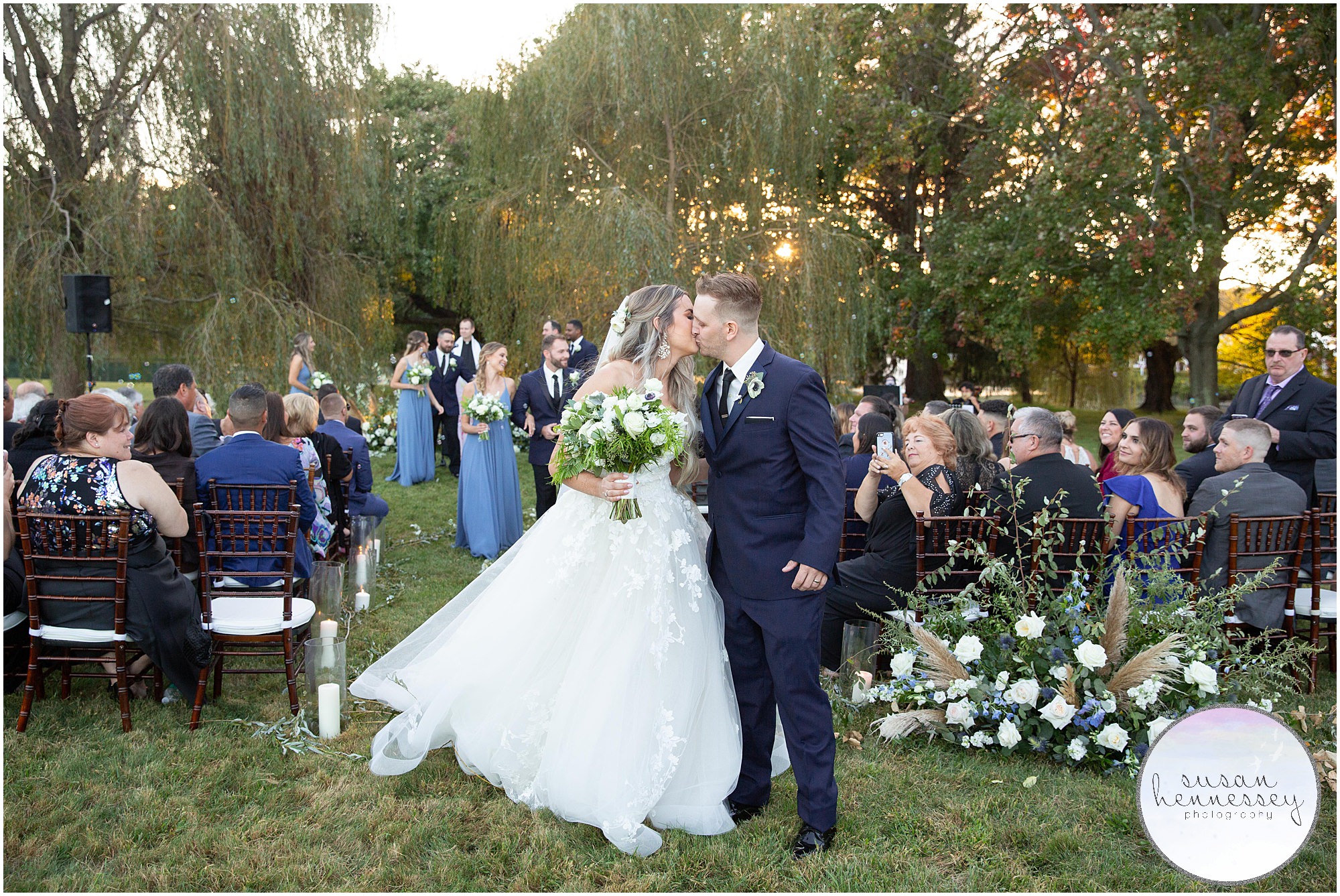 Ceremony in the willow trees at Windows on the Water at Frogbridge Wedding