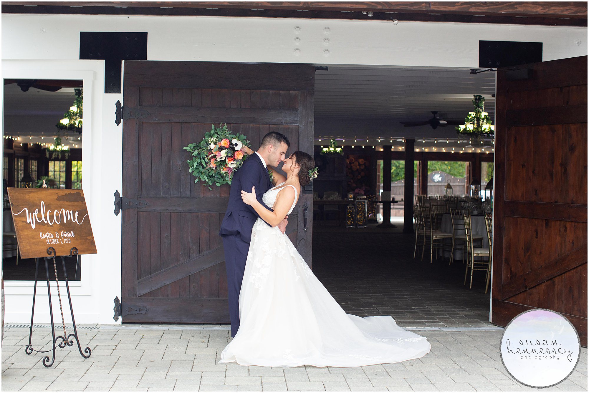 Bride and groom portraits in front of the barn doors at The Hamilton Manor wedding