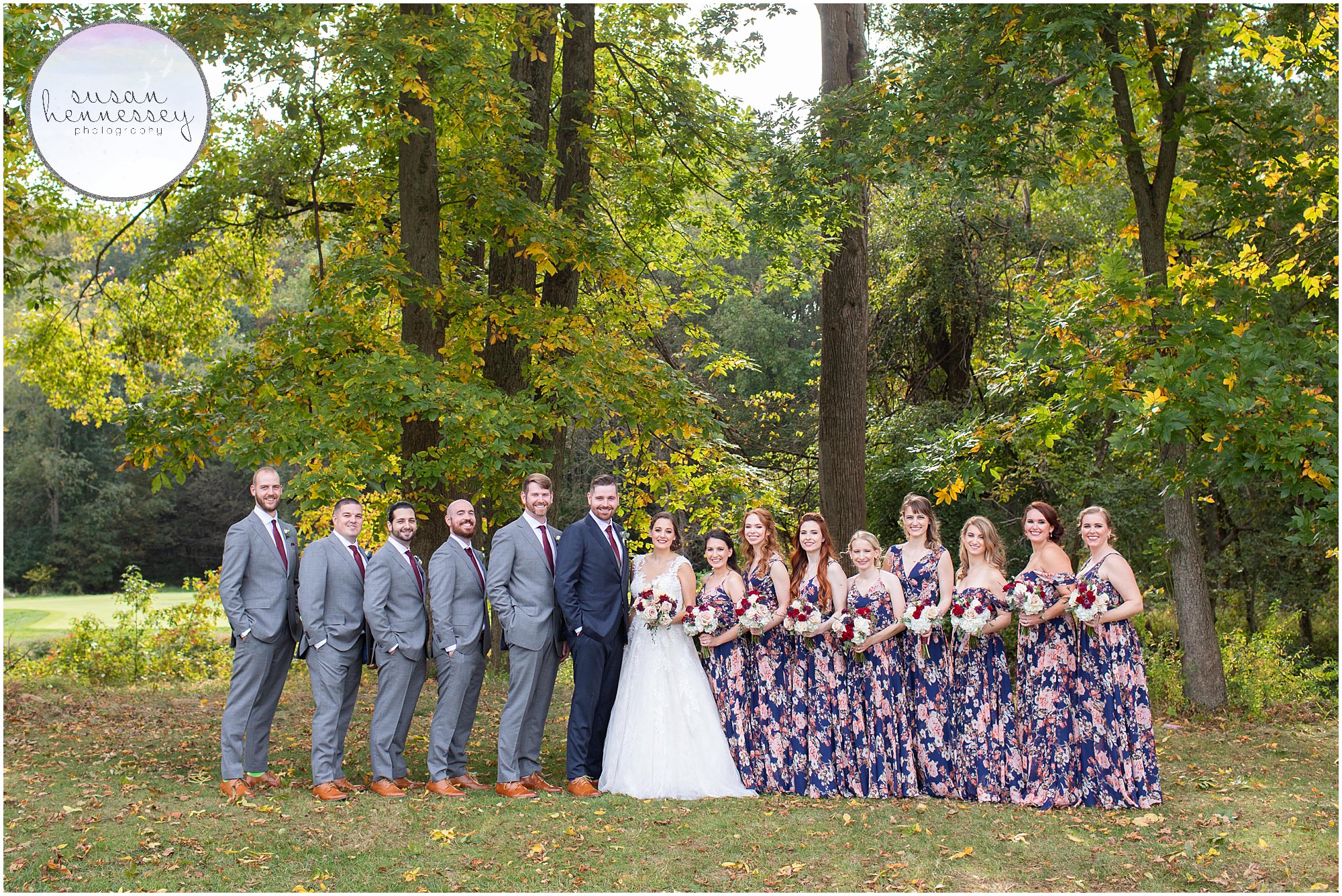 Bridal party portraits in fall foliage at Wedding at Old York Country Club