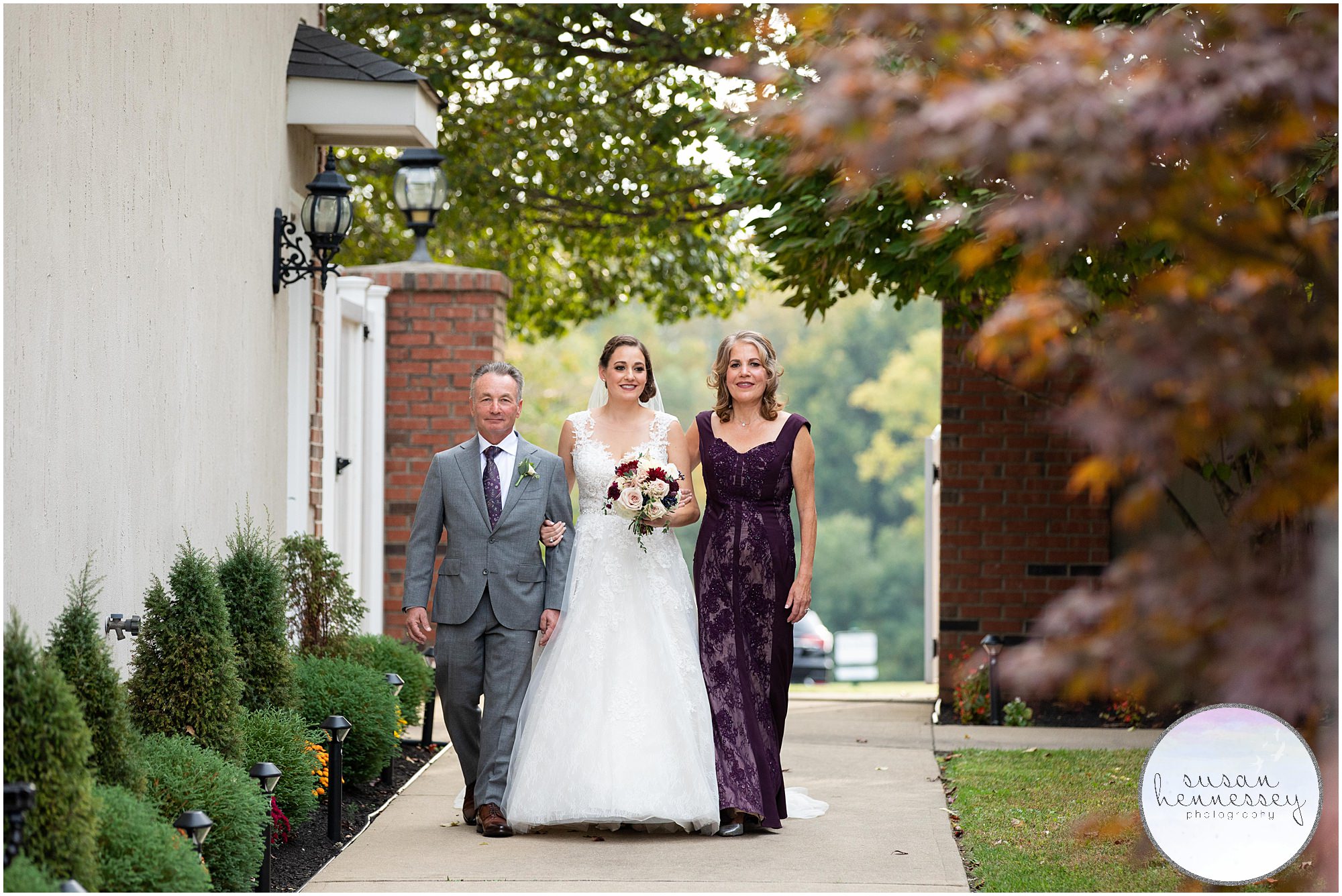 Bride and parents walk down aisle at Wedding at Old York Country Club