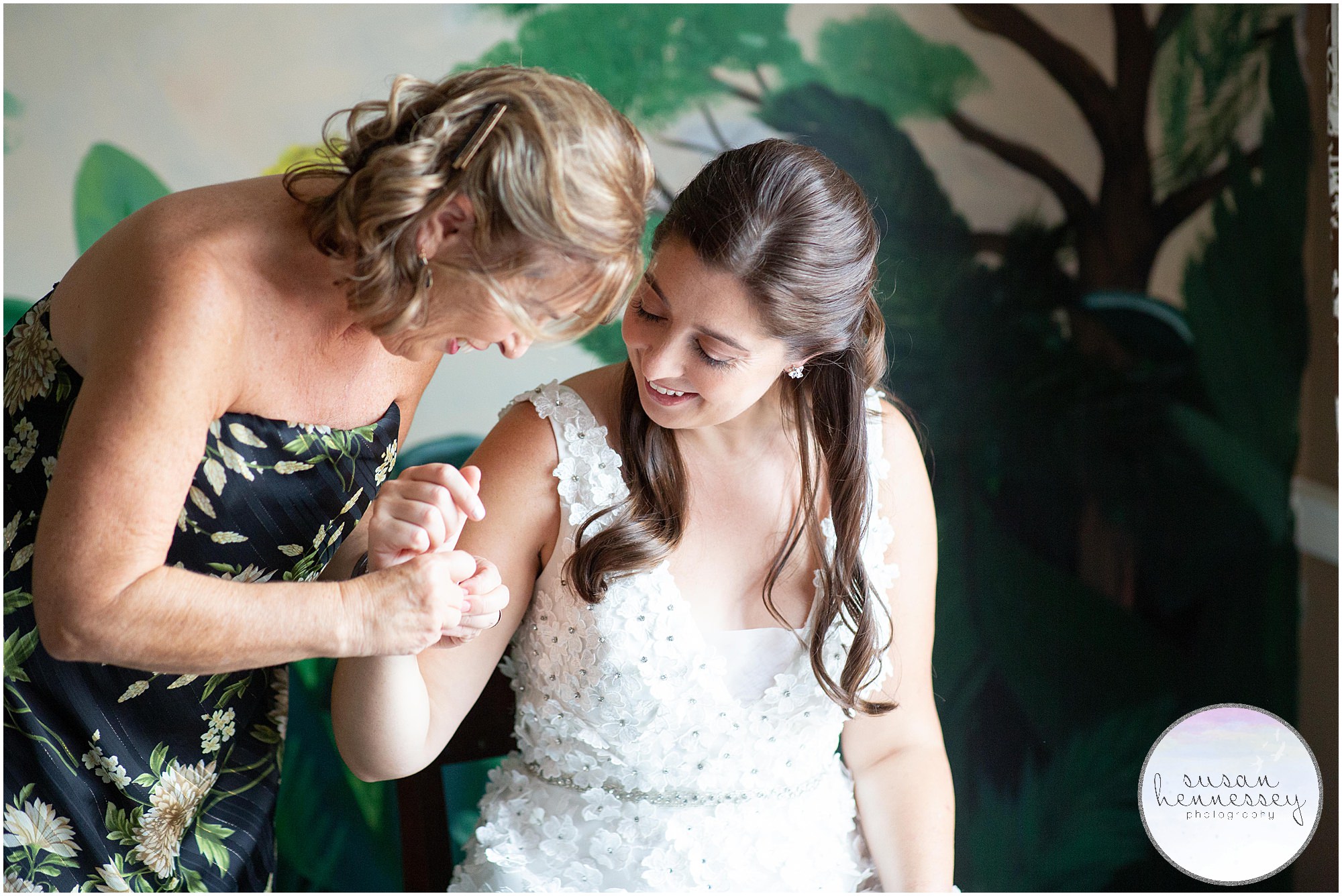 Mother of the bride helps with bracelet at Andre's Lakeside Dining Microwedding