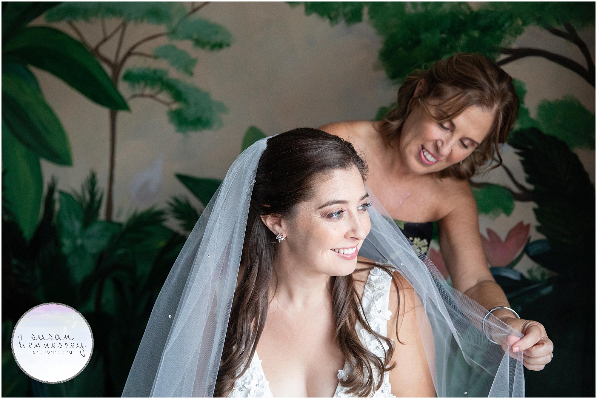 Mother of bride helps with cathedral veil