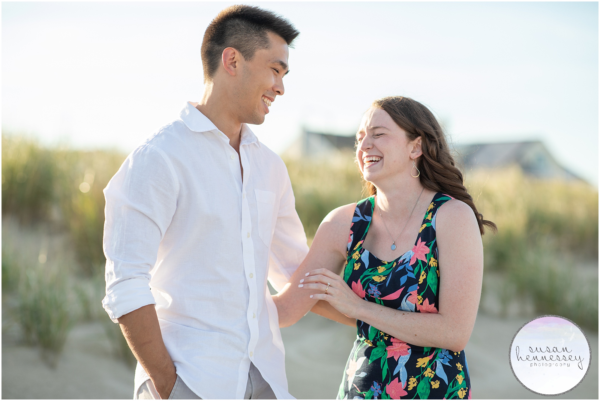 A coupe laugh at their Bradley Beach Engagement Session