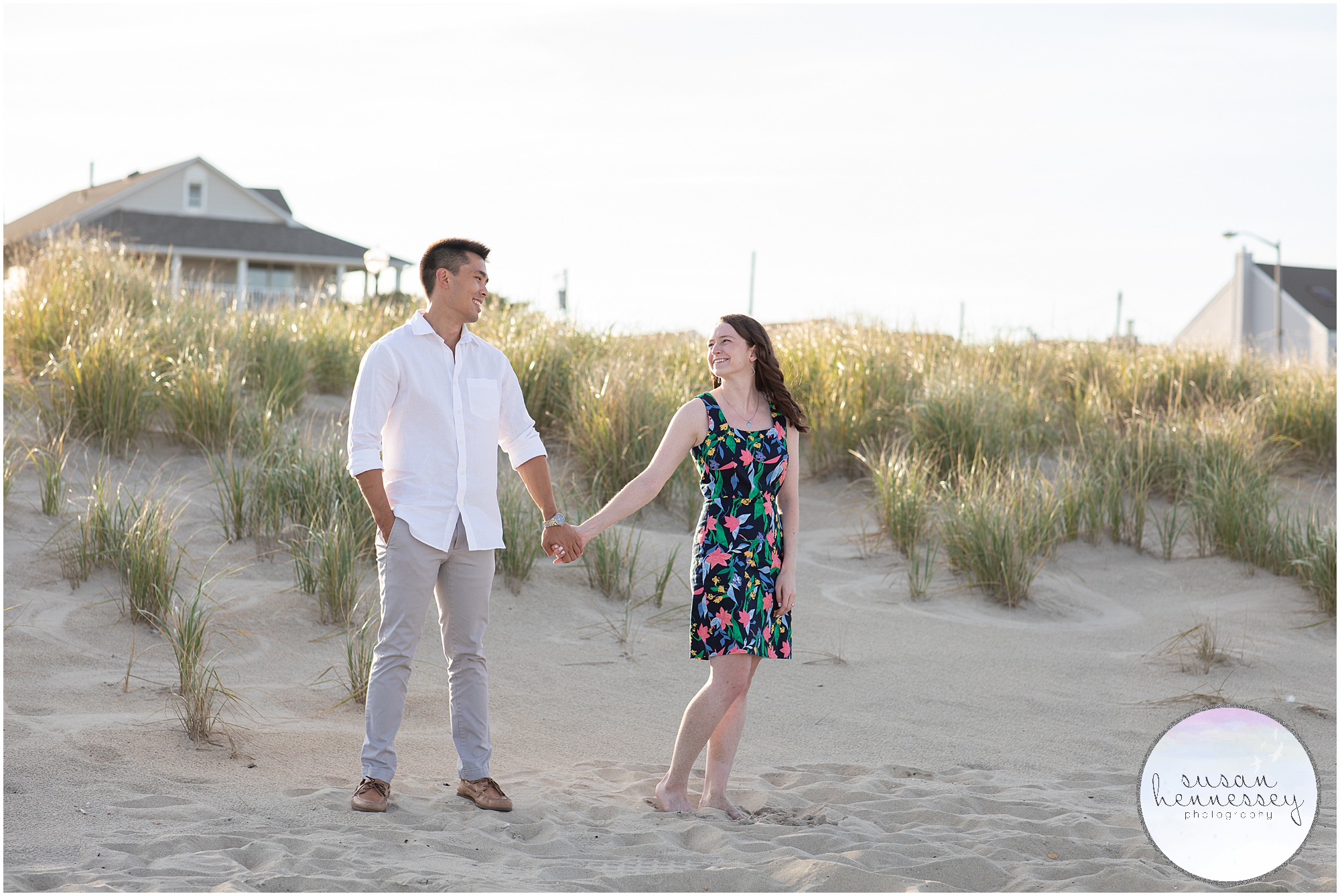 A couple pose in front of the dunes at their Bradley Beach Engagement Session