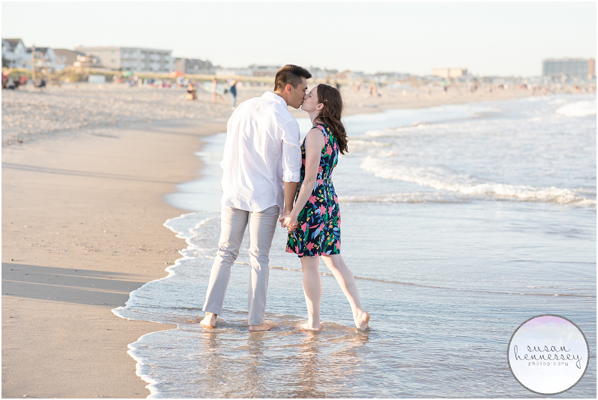 A couple kiss in the water at their Bradley Beach Engagement Session