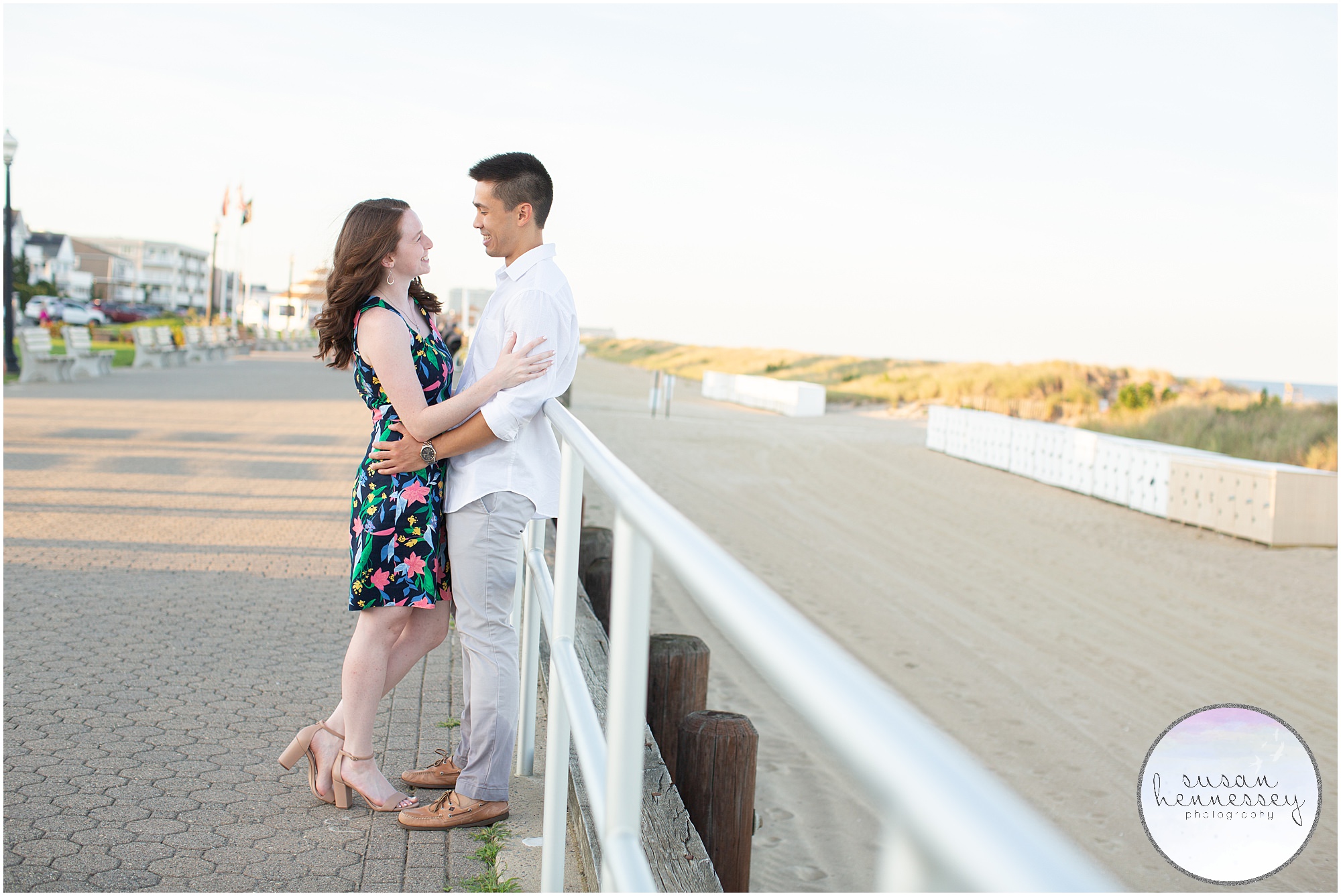 A couple on the boardwalk at their Bradley Beach Engagement Session