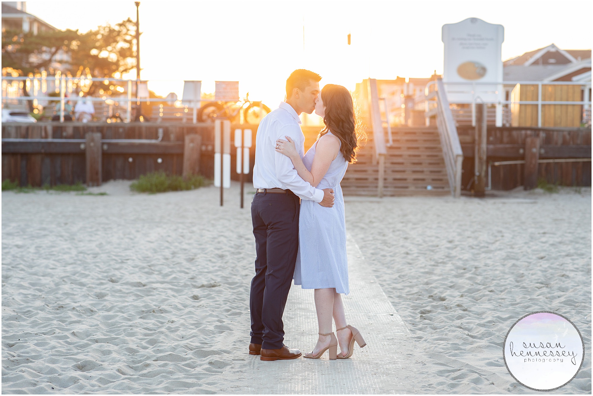 An engaged couple kiss during sunset at their Bradley Beach Engagement Session