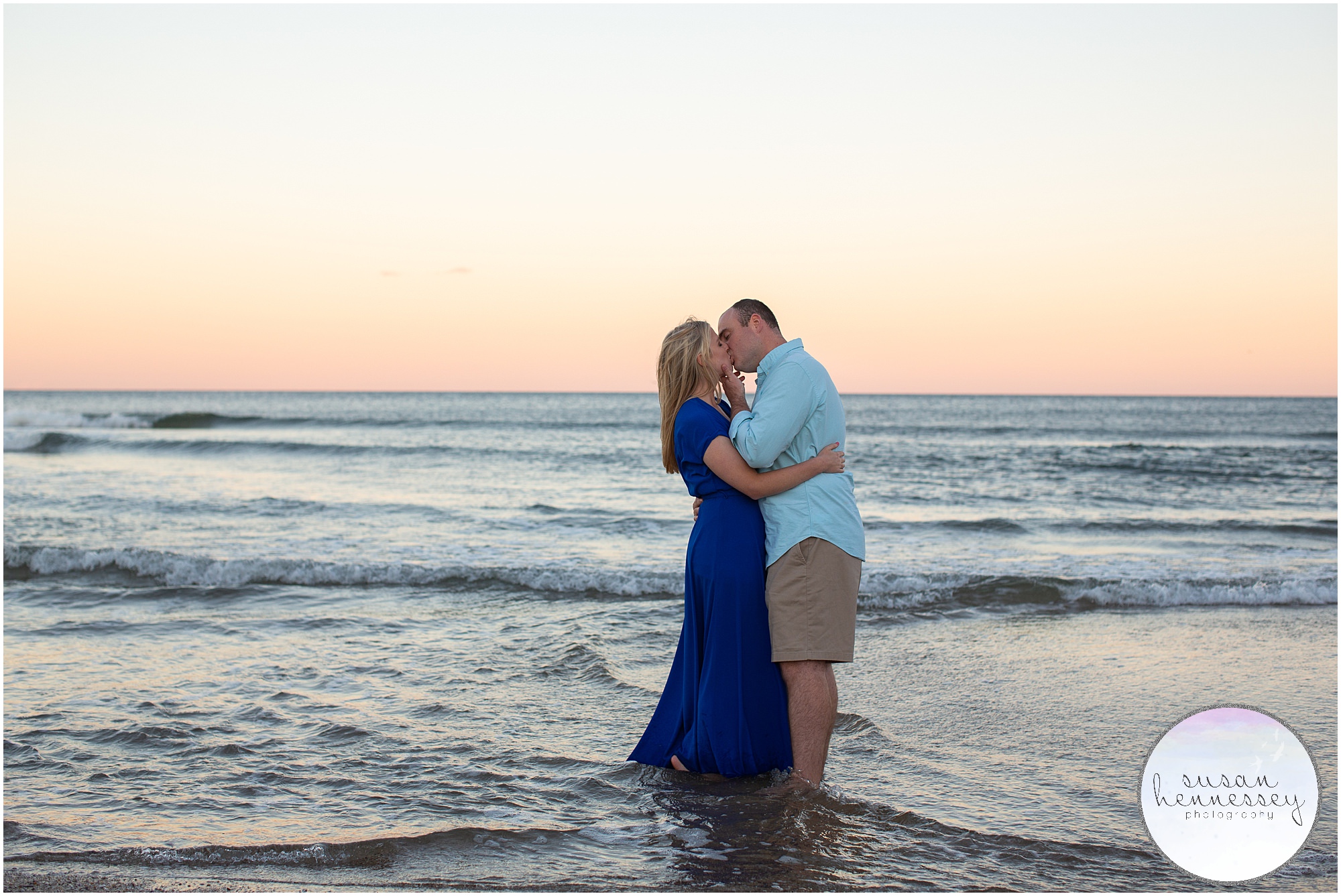 An engaged couple kiss in the water at their Engagement Session at Asbury Park