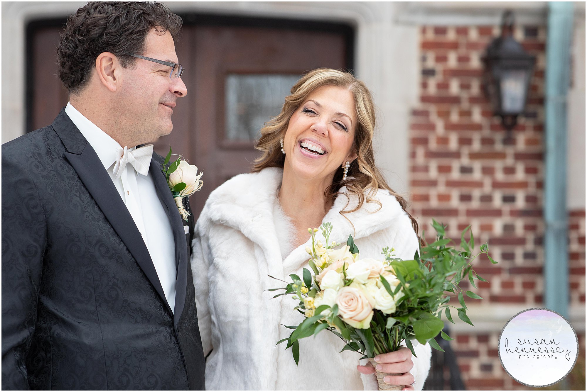 Bride and groom laugh at their winter microwedding