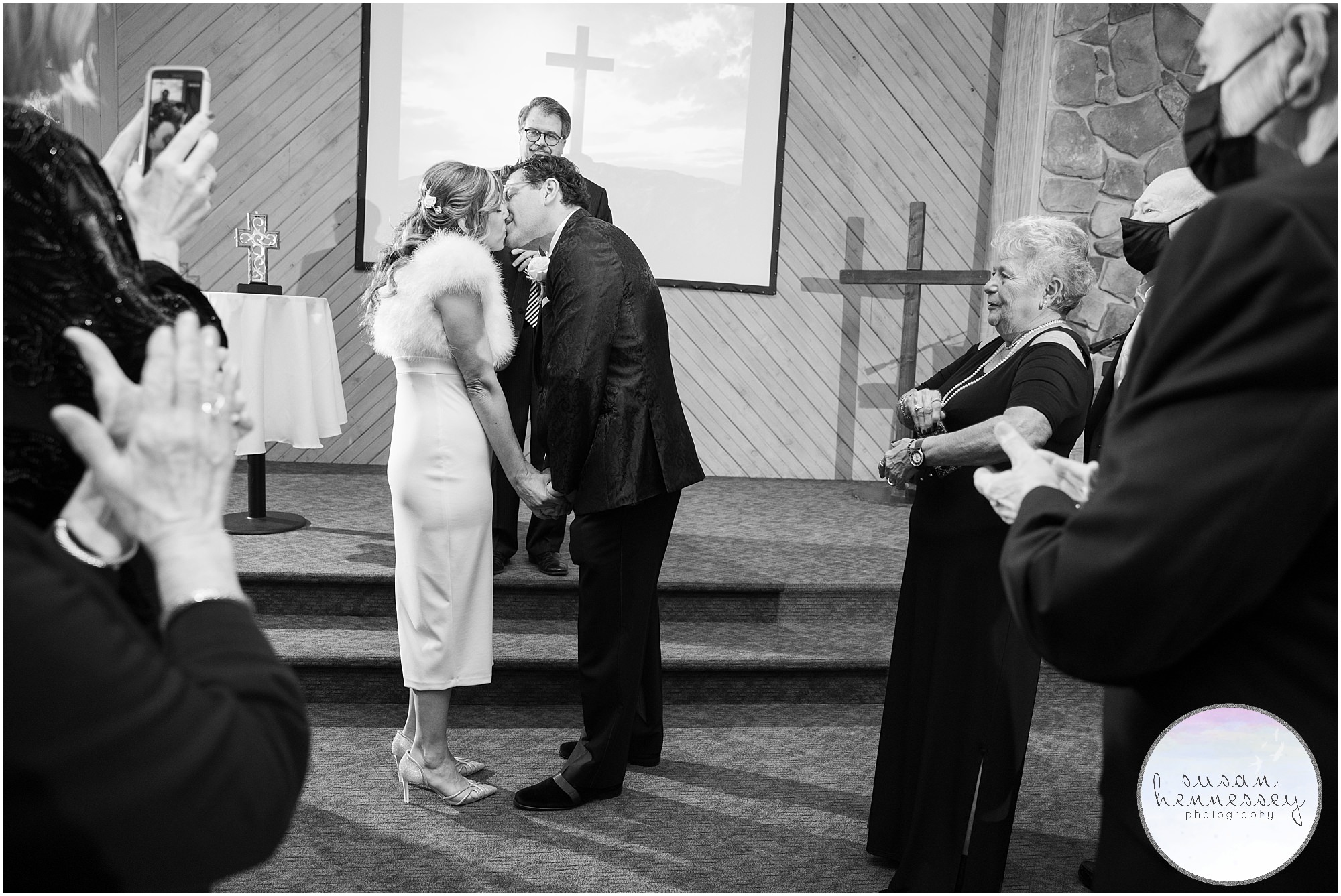 Couple kiss at their winter microwedding at Fellowship Alliance Chapel in South Jersey