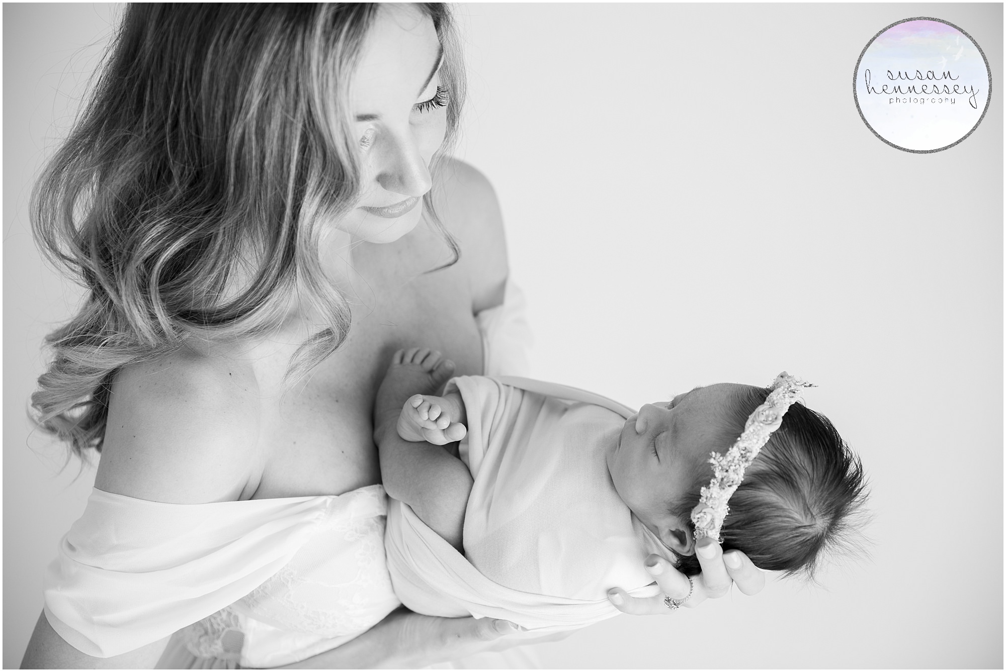 Black and white portrait of a mother and newborn during her Bump to Baby Collection