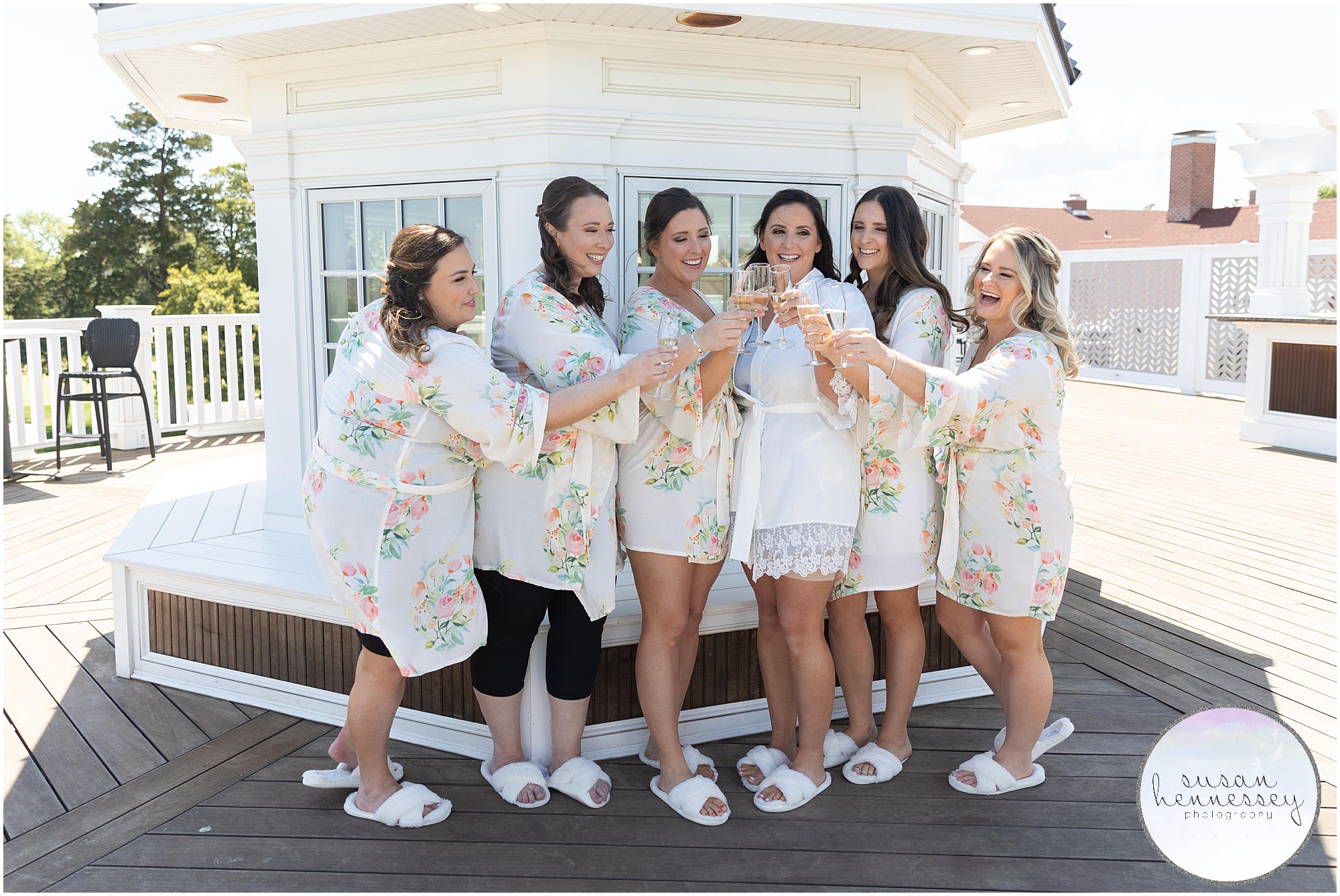 Bride and bridesmaids in matching robes at Atlantic City Country Club Wedding