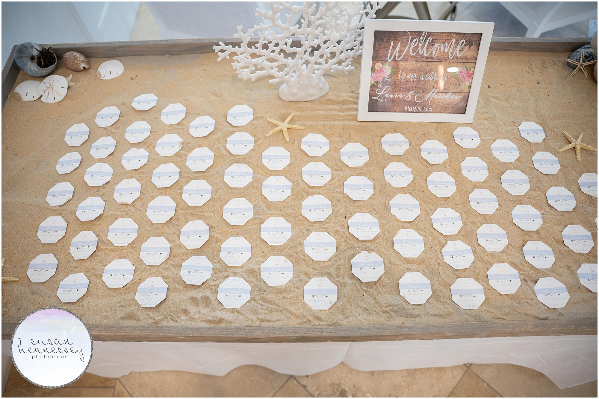 escort card beach badges at ICONA Avalon wedding