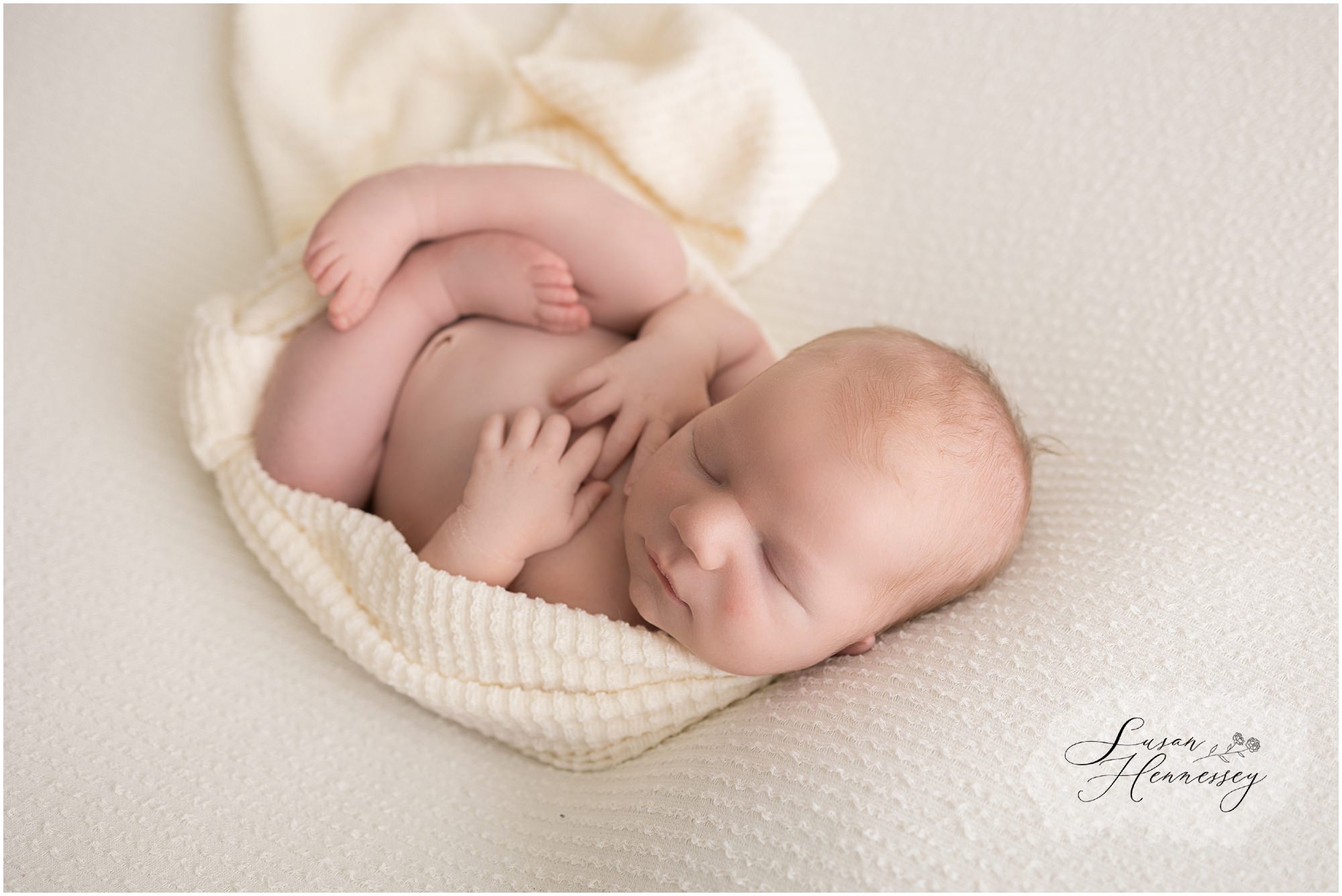 Neutral newborn photography photographed in studio by Susan Hennessey Photography. 