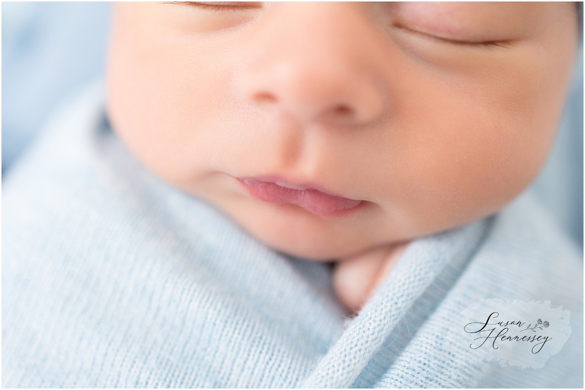 Close up of baby's face during in home newborn session