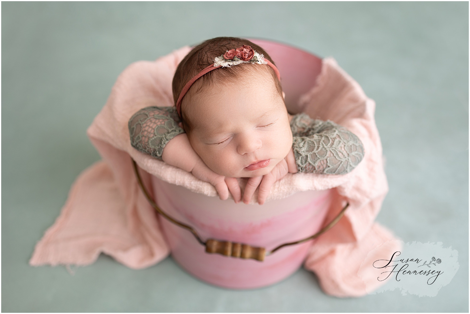 burlington county newborn photographer photographed a baby girl with a green and pink color palette 